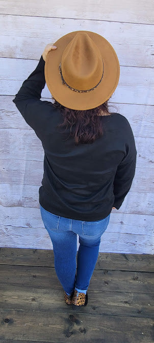 Canyon Cowgirl Description This is a comfy, buttery soft, heavier weight top, but not a sweatshirt. Canyon Cowgirl is a long sleeve black top, featuring blocked leopard print and western print on the front. Pair with your favorite pair of denim jeans, shorts, or jean skirt. Don’t be afraid to get creative! Sizes medium through x-large