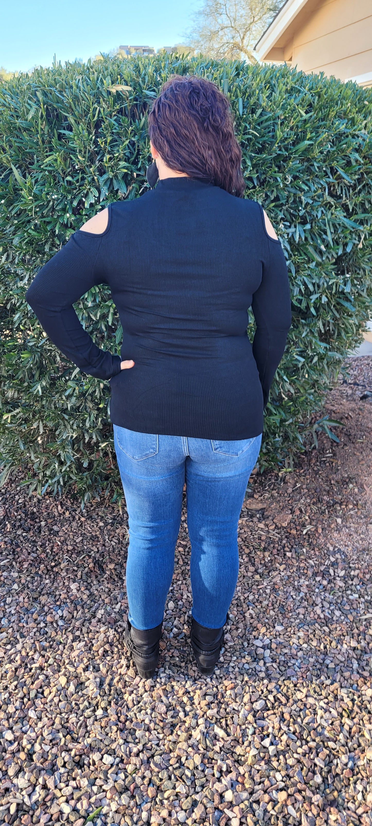 Imagine yourself in this cute staple piece. This top offers cold shoulders on both sides, ribbed material, and is light weight. Go ahead and be a little wild with this cutie! Show off your stuff! Sizes small through x-large.