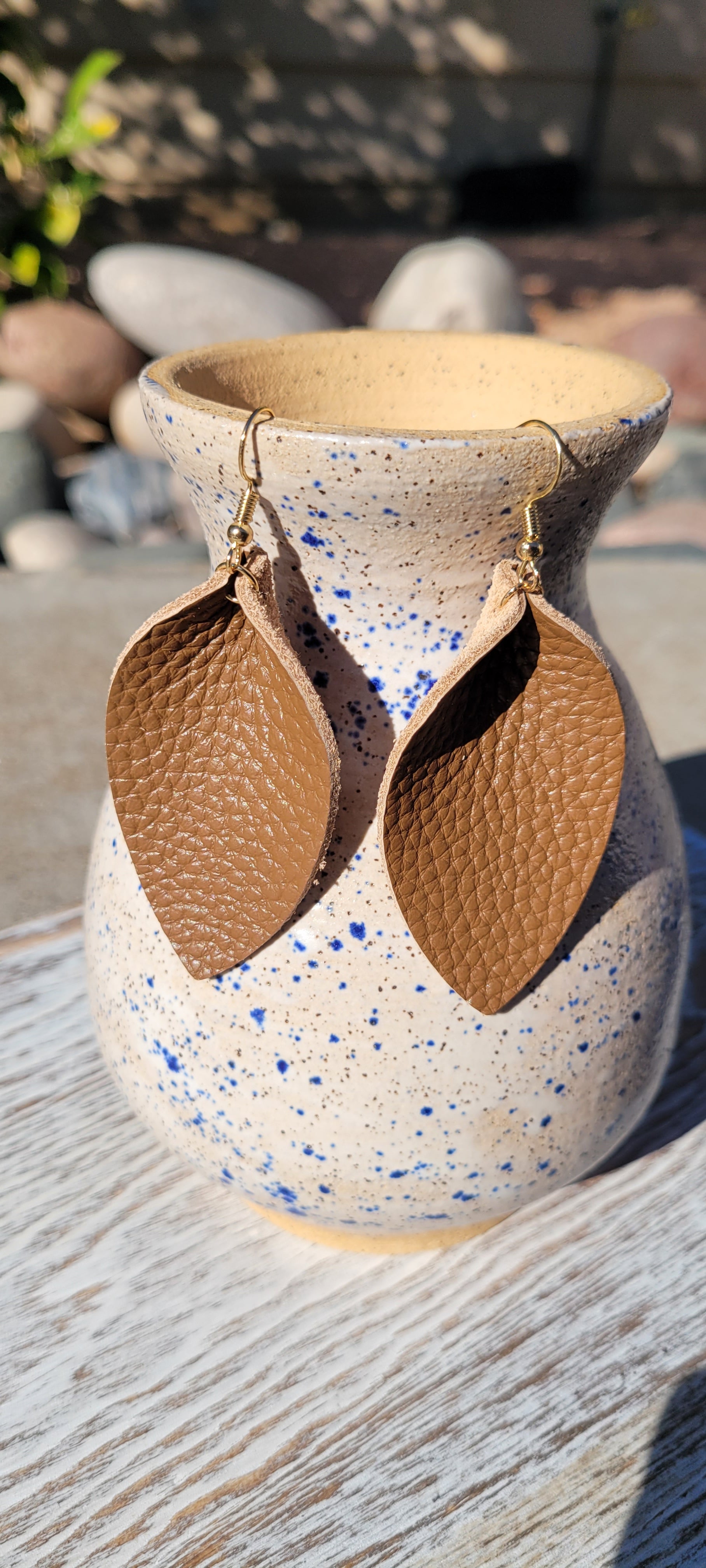 Teardrop shape Brown genuine leather Shiny brown Brushed gold fish hook dangle earrings Rubber earring back Whether you want to be on the wild side or classy this earring set it will add a fun touch to your outfit