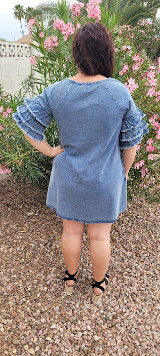 This light color denim dress features layered, short sleeves which have ruffles that are fringed/frayed, and comes above the knee . Just slip it on over your head and you are ready to go! Go ahead and strut your stuff! This dress is great for a date, going to the office, or hanging out with the girls. Change the look of your dress by wearing different style belts as an added feature. Belt not included. Sizes small through large.