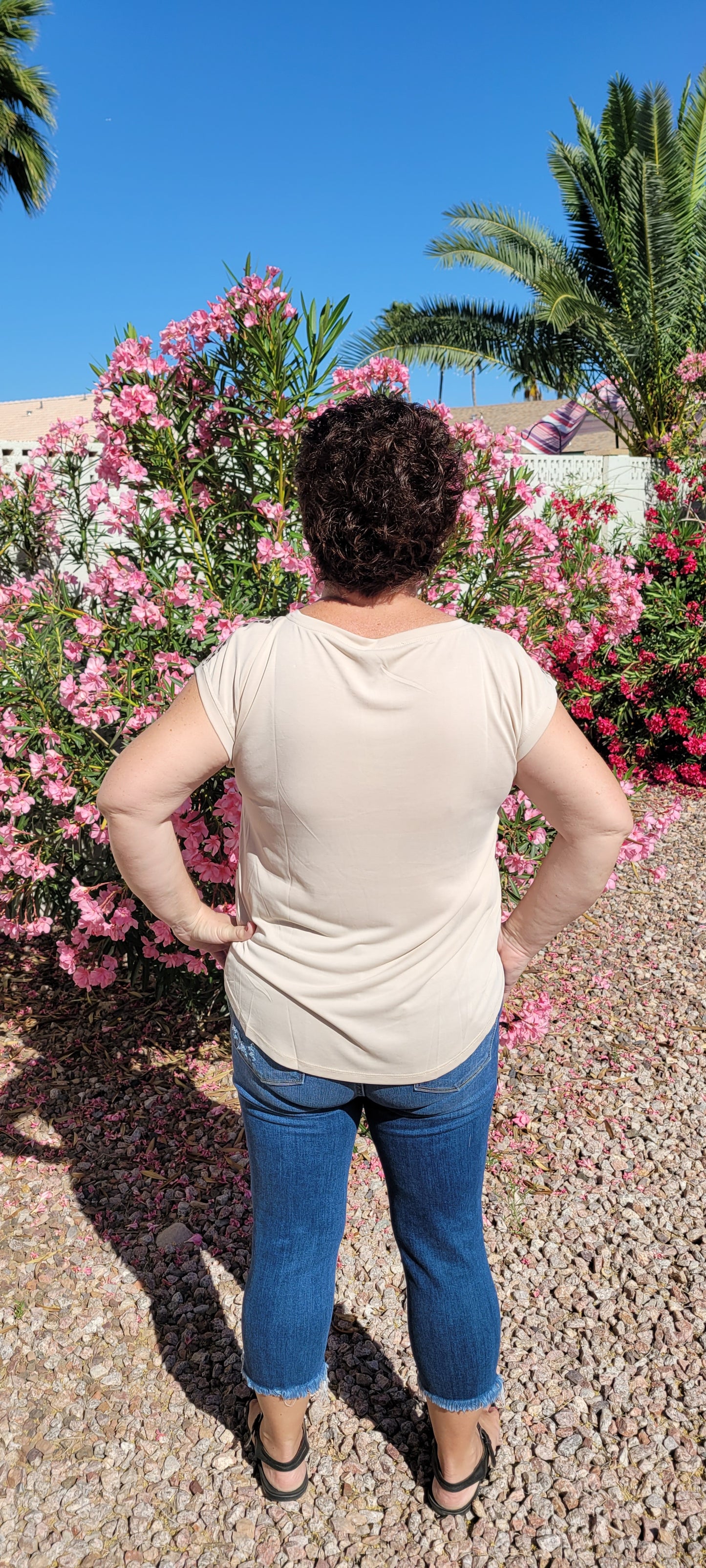 “Road Less Traveled” is a sleeveless top, with leopard print front (beige, brown, camel, agreeable gray) and contrast back, boat neckline, trimmed with beige soft modal, and rounded hemline. This is a satiny, silky soft high-low top. This is definitely a business or casual top. Sizes small through large.