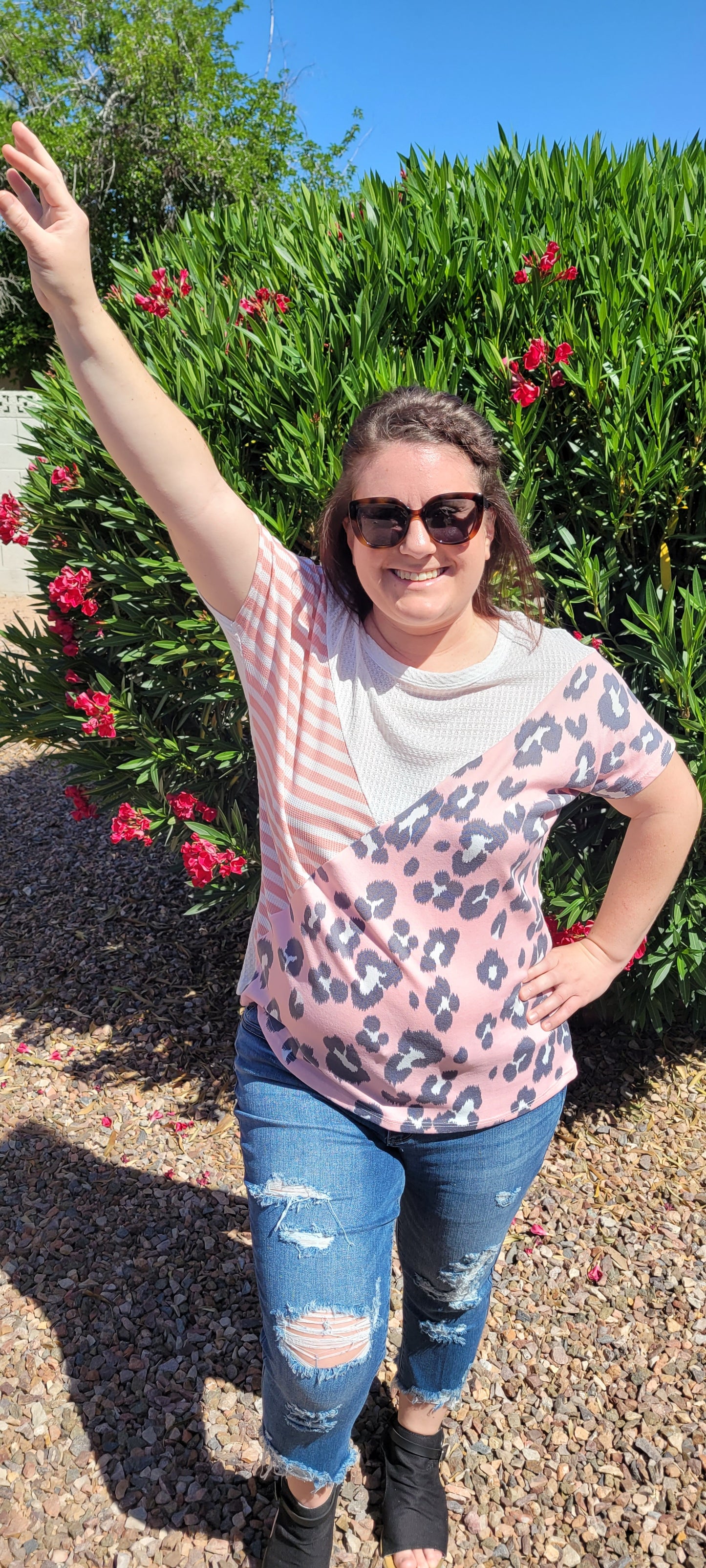 “Spoken From The Heart” is a comfy and casual t-shirt! This short sleeve shirt features pattern blocking, leopard print (pink, gray, white), stripes (coral, white) and solid waffle (white). This shirt has three different materials and textures, and a rounded neckline. Pair with your favorite pair of denim jeans, shorts, or skirt. Sizes small through large.