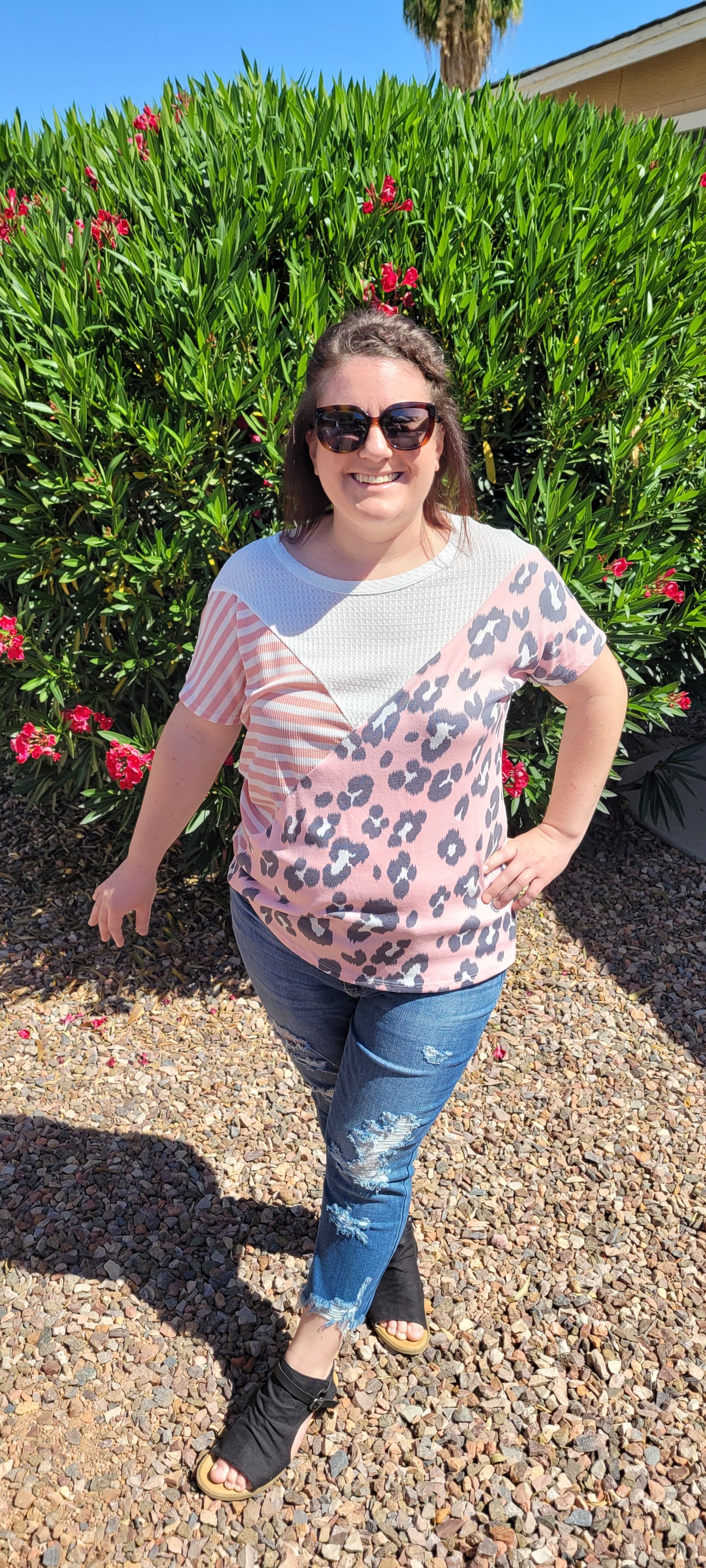 “Spoken From The Heart” is a comfy and casual t-shirt! This short sleeve shirt features pattern blocking, leopard print (pink, gray, white), stripes (coral, white) and solid waffle (white). This shirt has three different materials and textures, and a rounded neckline. Pair with your favorite pair of denim jeans, shorts, or skirt. Sizes small through large.
