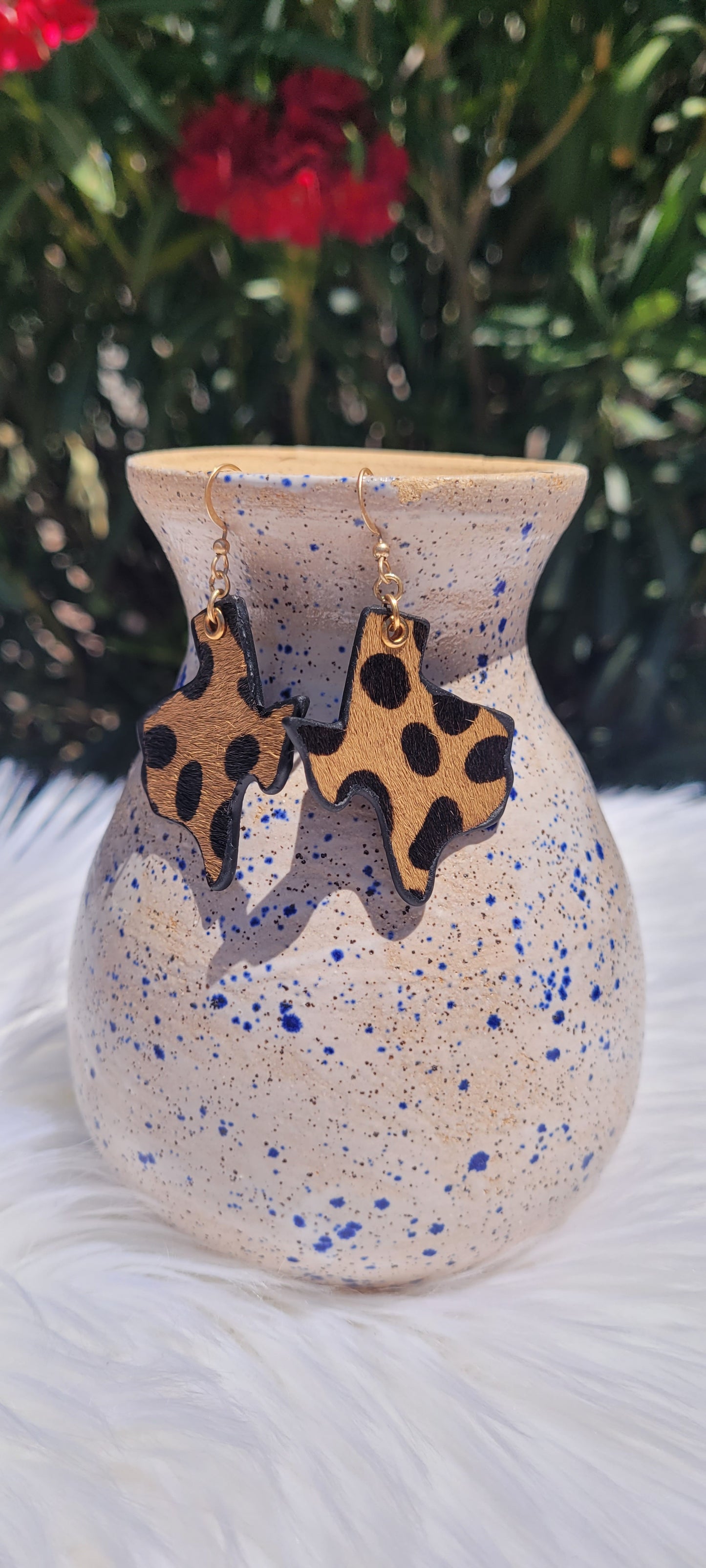 Texas design Genuine leather Brown animal print Brushed gold fish hook dangle earrings Brushed gold eyelet Rubber earring back Whether you want to be on the wild side or classy this earring set it will add a fun touch to your outfit