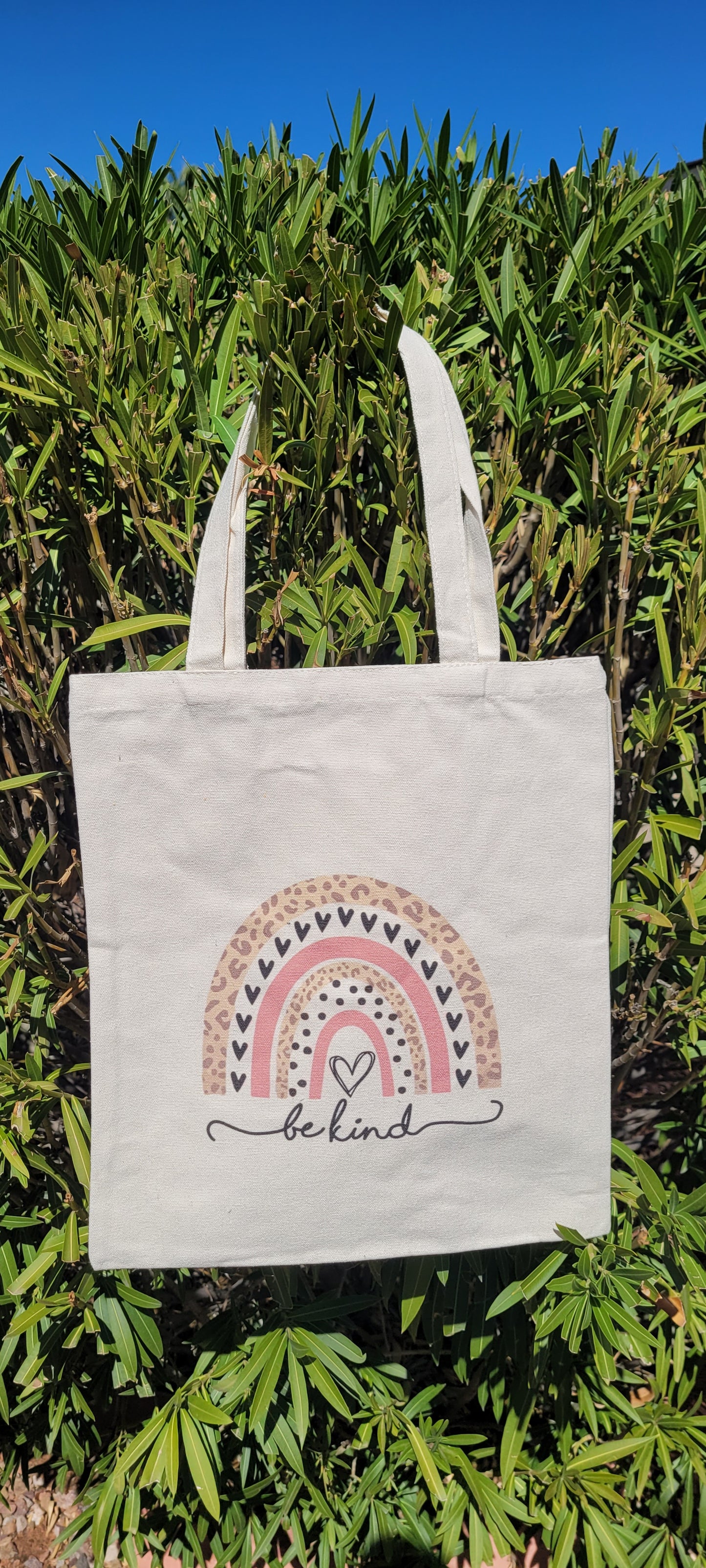 These trendy tote bags are a must have! Rainbow pattern with leopard print, rose color, hearts Material is polyester Size is height: 15.25 inch, width: 13.5 inch, diameter: 0.125 inch and strap height: 8.5 inch