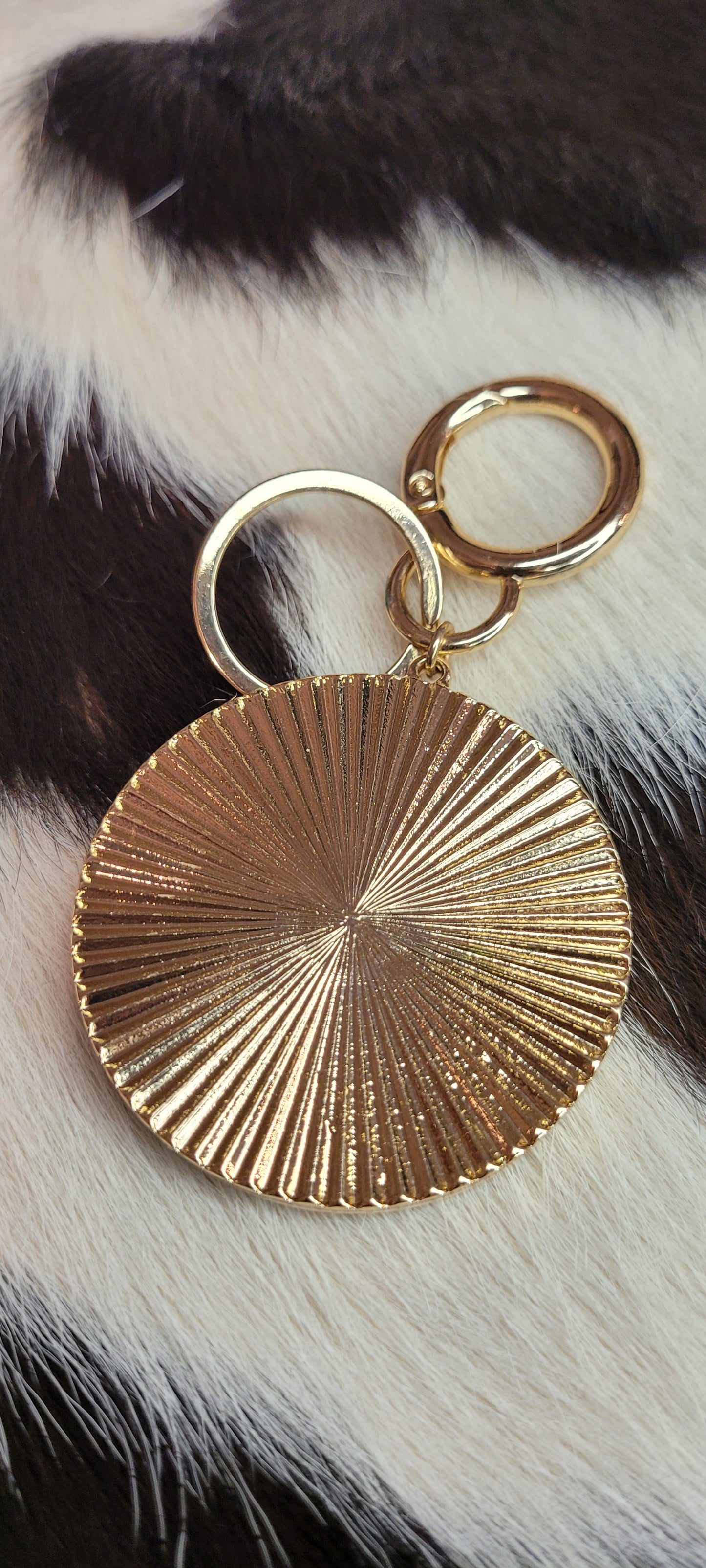3.5 inch paved starburst keychain Real calf hair and leather, cheetah print Gold color chain and key ring These key chains will not last long