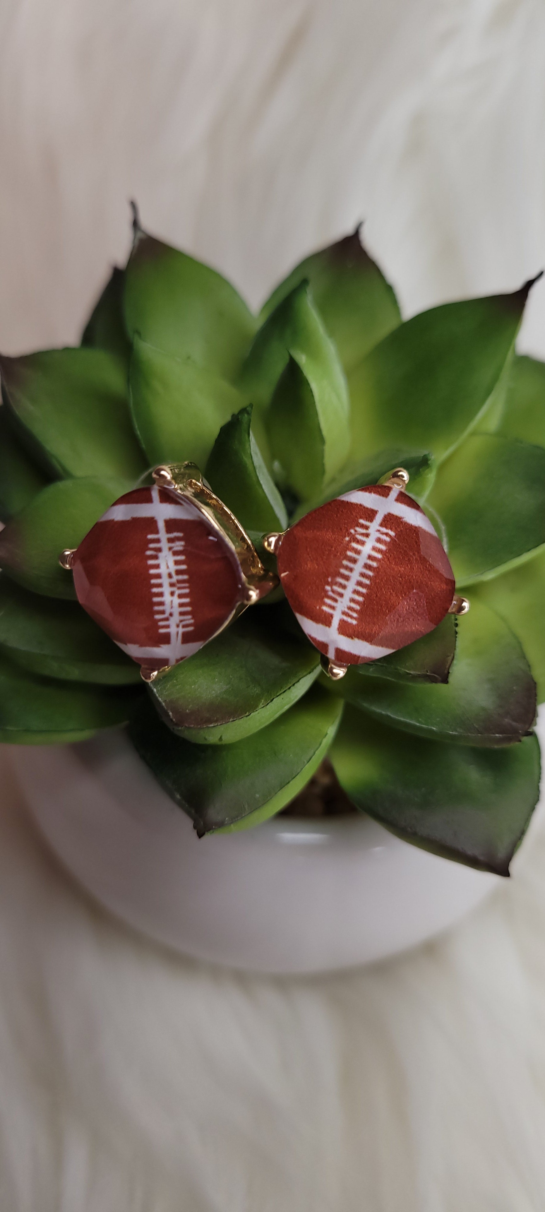 Color: brown, white Epoxy material Light weight Brushed gold post earrings Plastic/metal earring back Width 0.5 inch Go team go!