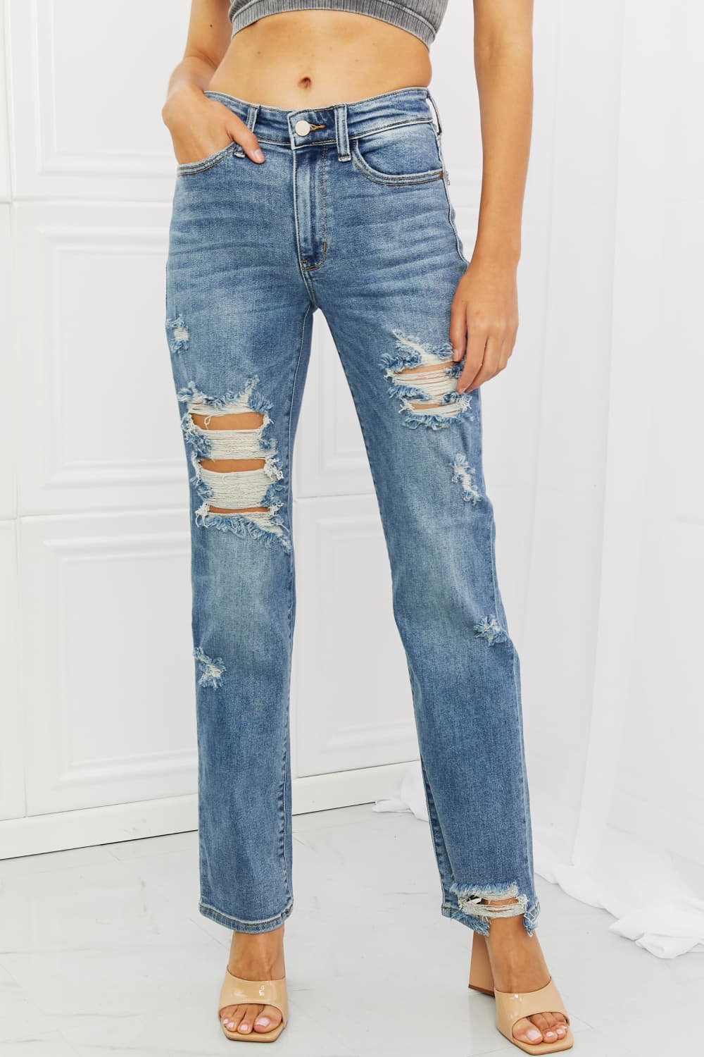 These jeans are the perfect combination of style and comfort, making them a must-have in every fashion-forward individual's wardrobe.The heavy distressing adds a touch of edginess to the classic straight-leg silhouette, making them perfect for a night out with the girls or a casual weekend brunch.