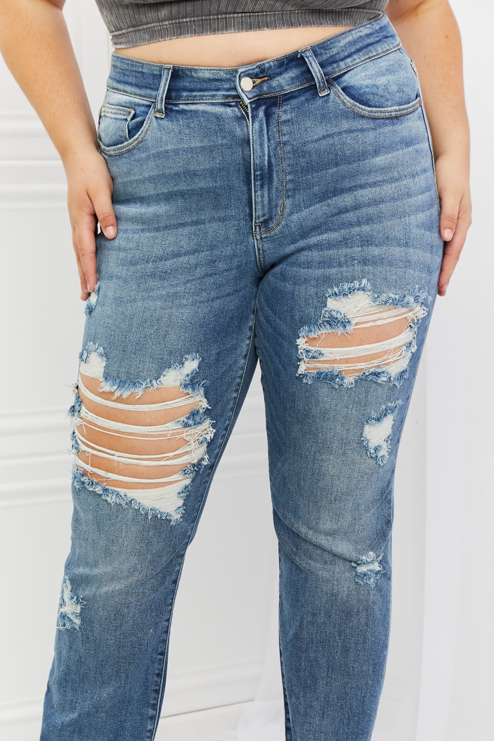 These jeans are the perfect combination of style and comfort, making them a must-have in every fashion-forward individual's wardrobe.The heavy distressing adds a touch of edginess to the classic straight-leg silhouette, making them perfect for a night out with the girls or a casual weekend brunch.
