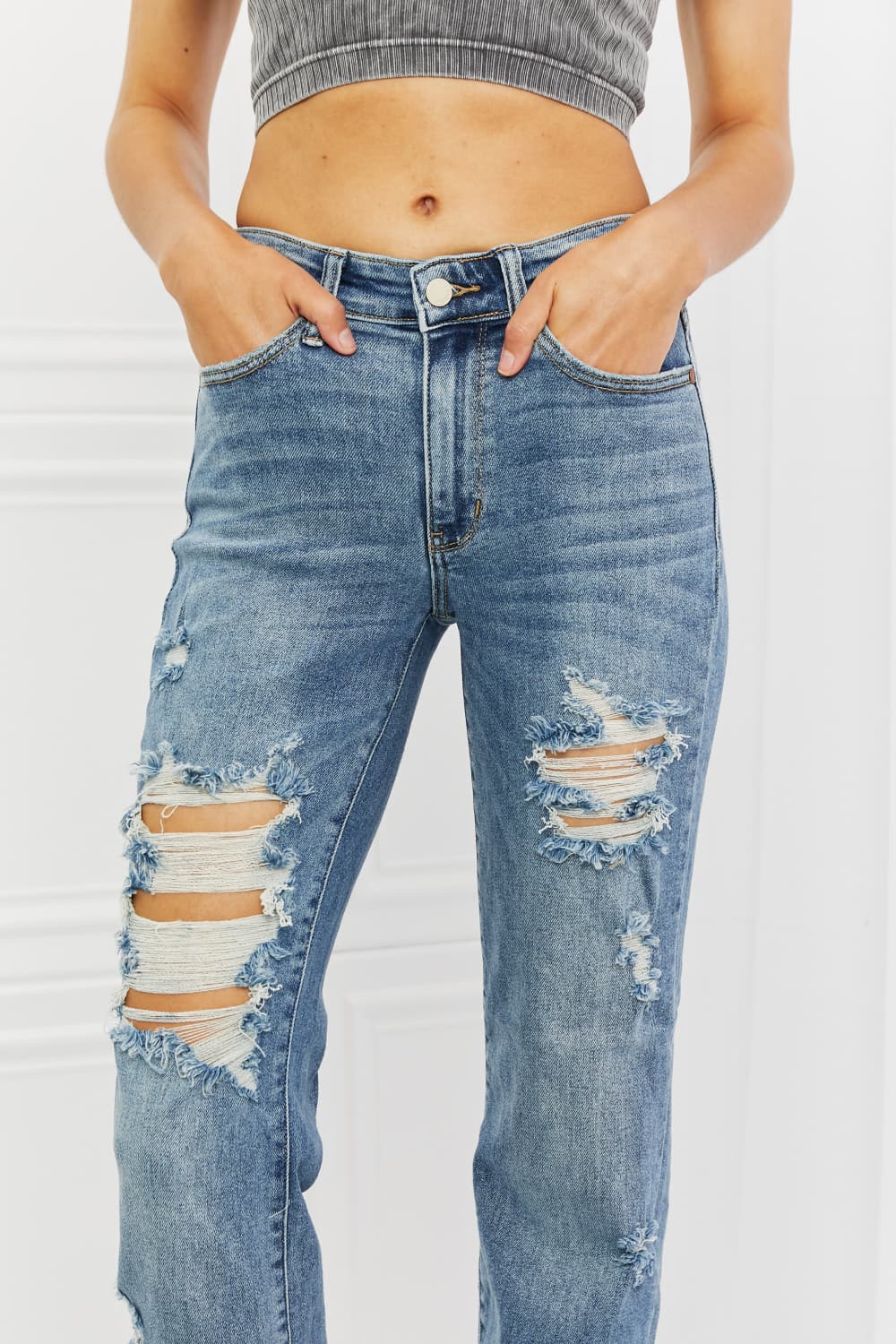 These jeans are the perfect combination of style and comfort, making them a must-have in every fashion-forward individual's wardrobe.The heavy distressing adds a touch of edginess to the classic straight-leg silhouette, making them perfect for a night out with the girls or a casual weekend brunch.