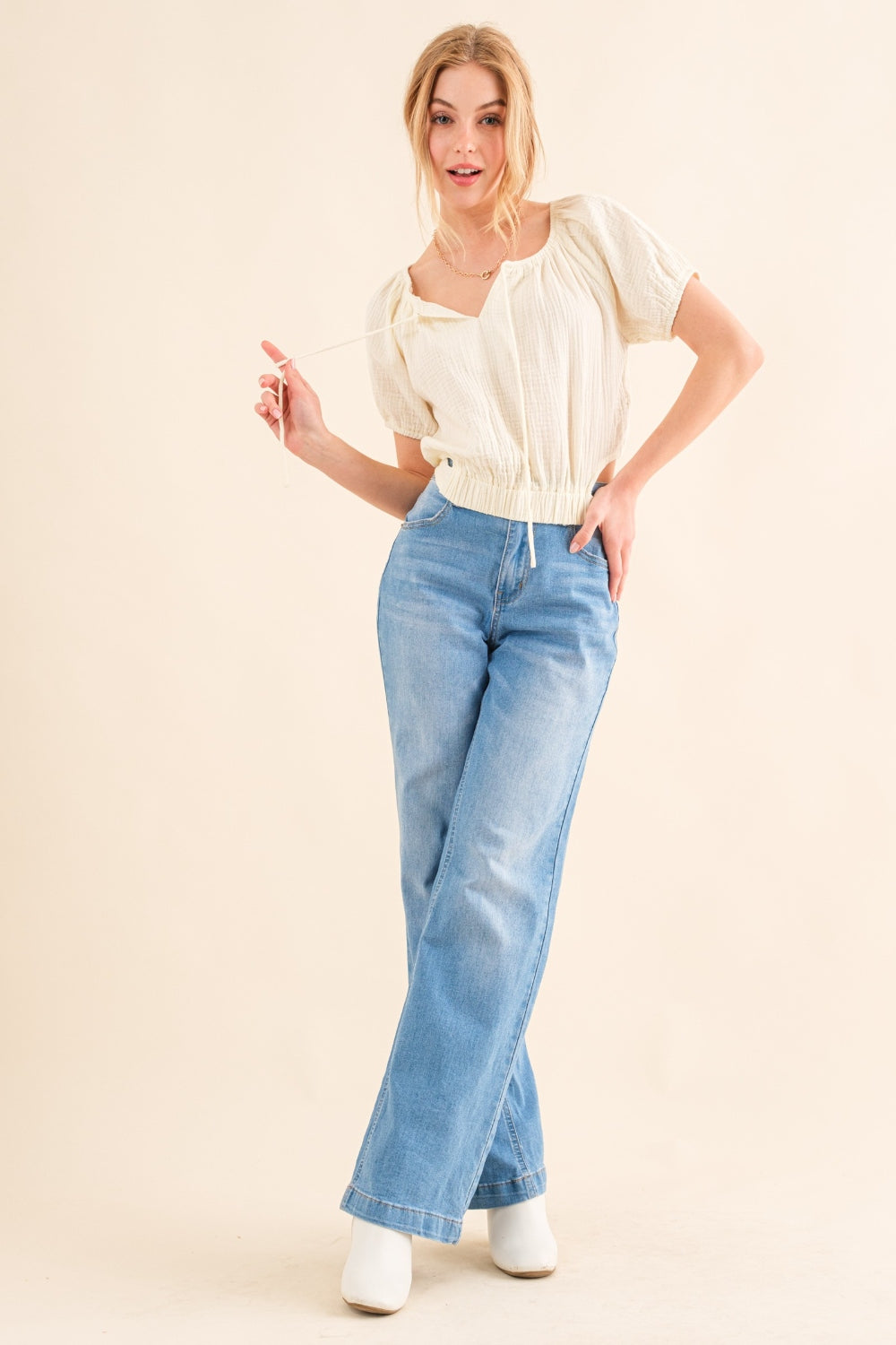 This Cotton Gauze Back Waist Tie Cropped Top is a stylish and versatile piece for your wardrobe. The back waist tie adds a unique touch to the design. Made with lightweight cotton gauze fabric, it is comfortable to wear in any season. S - XL
