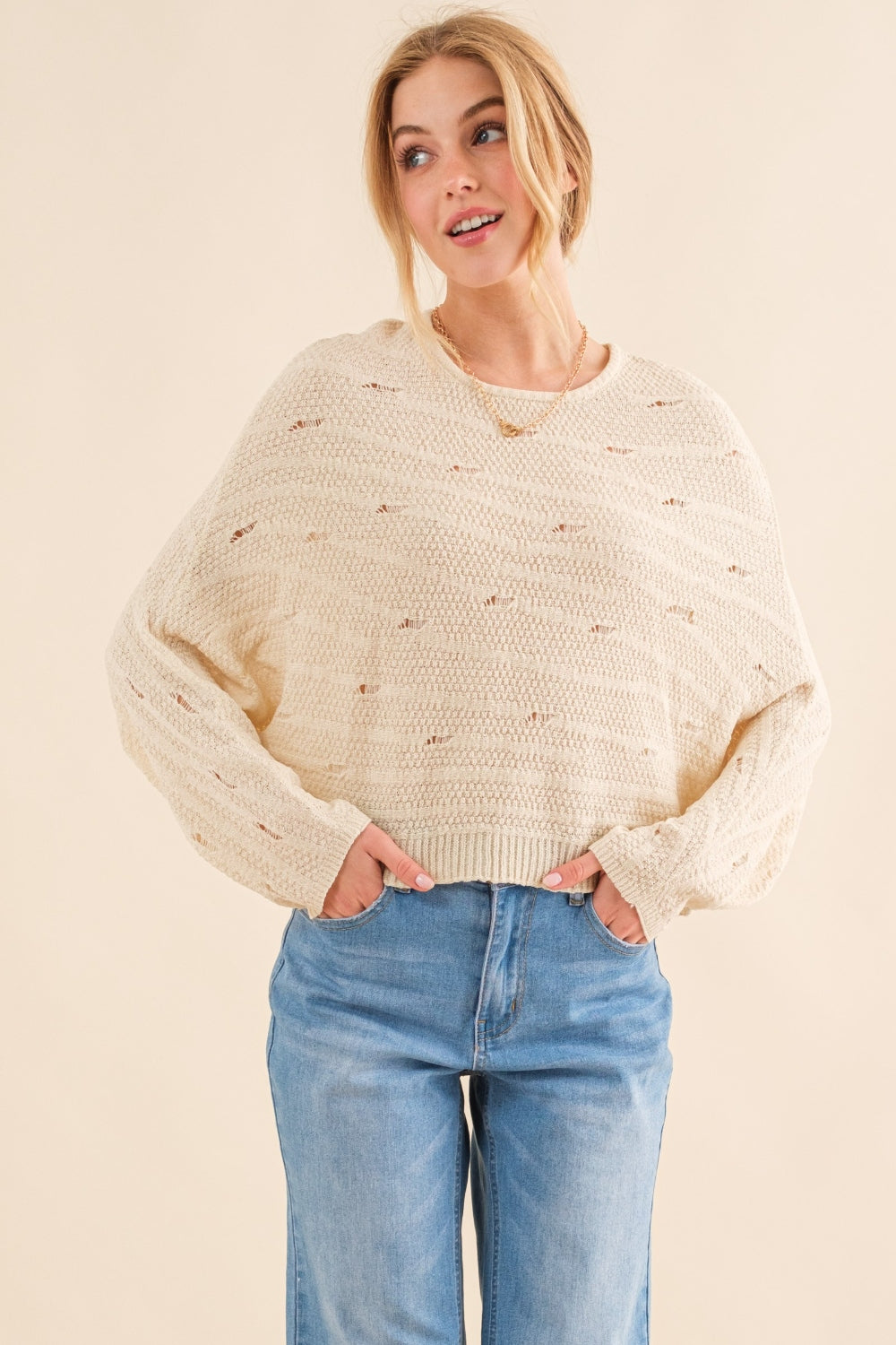 The Dolman Sleeves Sweater is a cozy and stylish addition to your wardrobe, perfect for the cooler months. The relaxed fit and dolman sleeves create a comfortable and effortless look that is both trendy and versatile. Crafted from soft and warm materials, this sweater is ideal for layering over a camisole or wearing on its own.