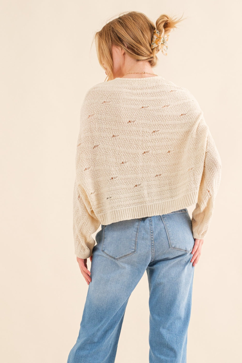 The Dolman Sleeves Sweater is a cozy and stylish addition to your wardrobe, perfect for the cooler months. The relaxed fit and dolman sleeves create a comfortable and effortless look that is both trendy and versatile. Crafted from soft and warm materials, this sweater is ideal for layering over a camisole or wearing on its own.