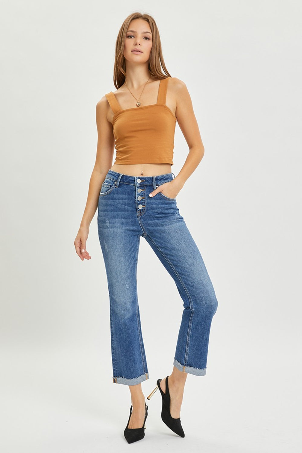 The Button-Fly Cropped Bootcut Jeans are a stylish and modern twist on a classic denim silhouette. The button fly closure adds a retro and chic touch to the cropped bootcut style. Made from high-quality denim fabric, these jeans are durable and comfortable for all-day wear. 0 - 3X
