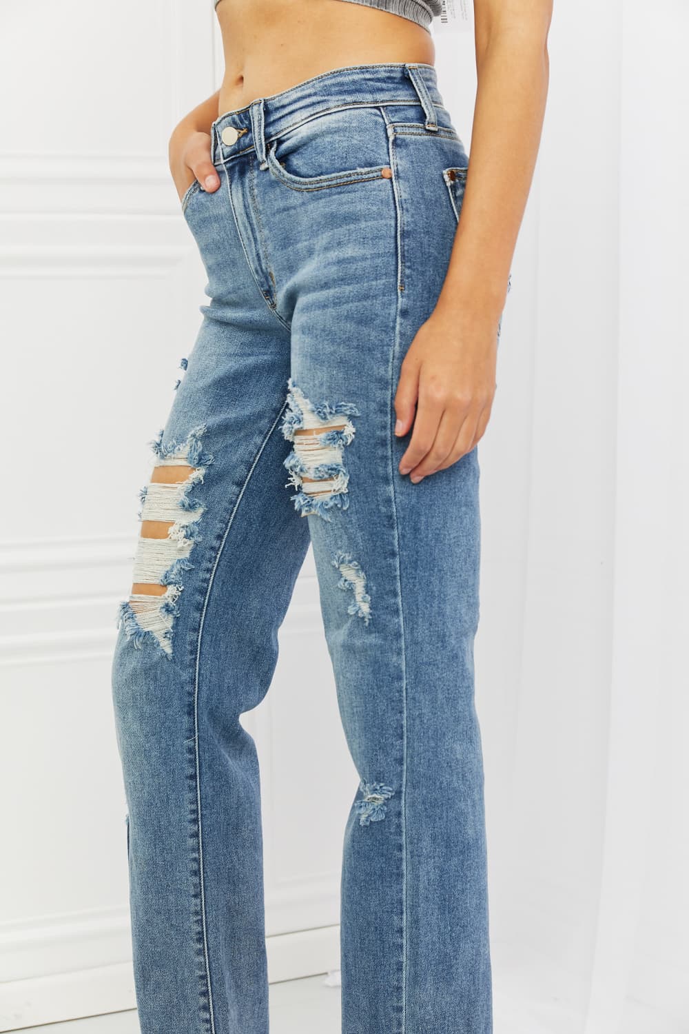 These jeans are the perfect combination of style and comfort, making them a must-have in every fashion-forward individual's wardrobe.The heavy distressing adds a touch of edginess to the classic straight-leg silhouette, making them perfect for a night out with the girls or a casual weekend brunch.