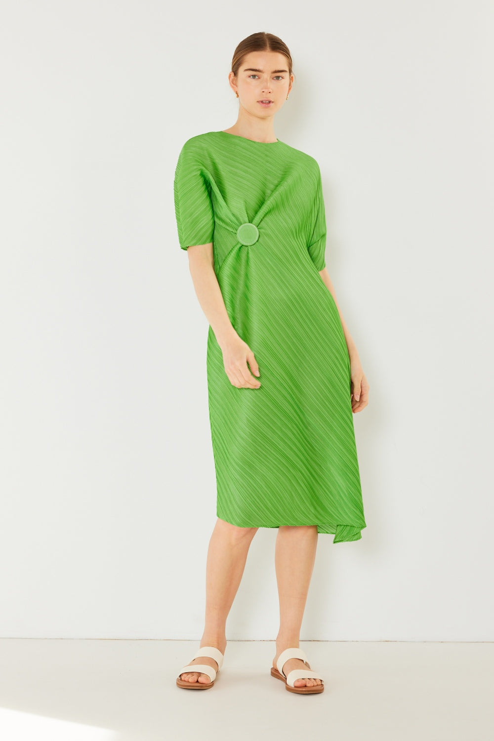 The Pleated Dolman Sleeve Dress is a modern and chic addition to your wardrobe. With its unique dolman sleeves and pleated detailing, this dress offers a stylish and sophisticated look. The relaxed silhouette and pleats create a flattering and comfortable fit.