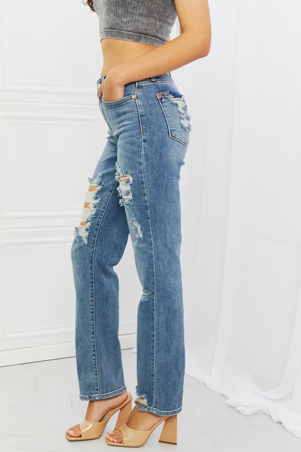 These jeans are the perfect combination of style and comfort, making them a must-have in every fashion-forward individual's wardrobe.The heavy distressing adds a touch of edginess to the classic straight-leg silhouette, making them perfect for a night out with the girls or a casual weekend brunch.