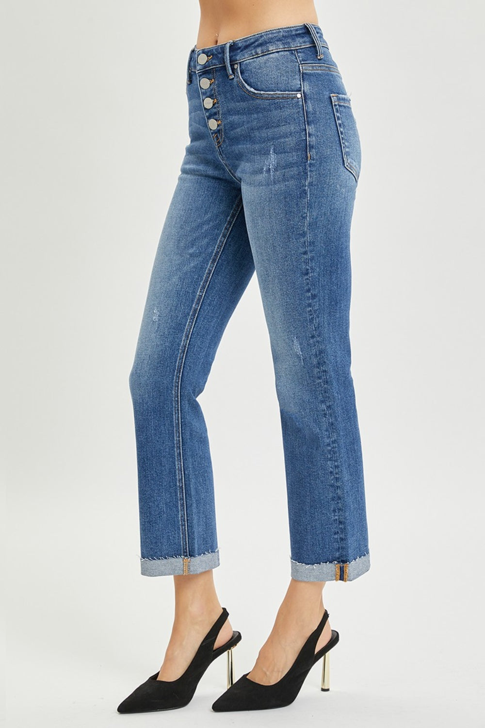 The Button-Fly Cropped Bootcut Jeans are a stylish and modern twist on a classic denim silhouette. The button fly closure adds a retro and chic touch to the cropped bootcut style. Made from high-quality denim fabric, these jeans are durable and comfortable for all-day wear. 0 - 3X