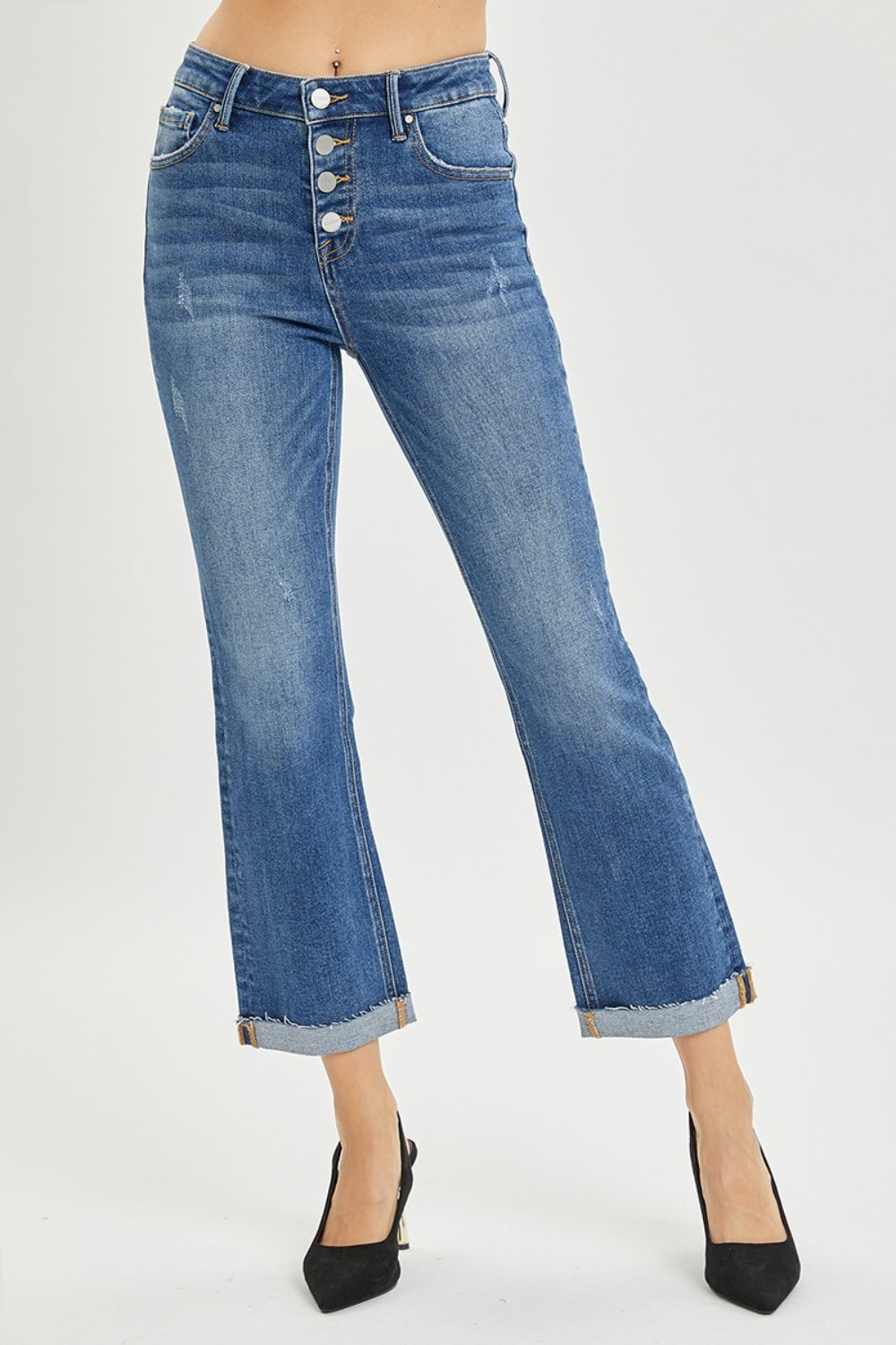 The Button-Fly Cropped Bootcut Jeans are a stylish and modern twist on a classic denim silhouette. The button fly closure adds a retro and chic touch to the cropped bootcut style. Made from high-quality denim fabric, these jeans are durable and comfortable for all-day wear. 0 - 3X
