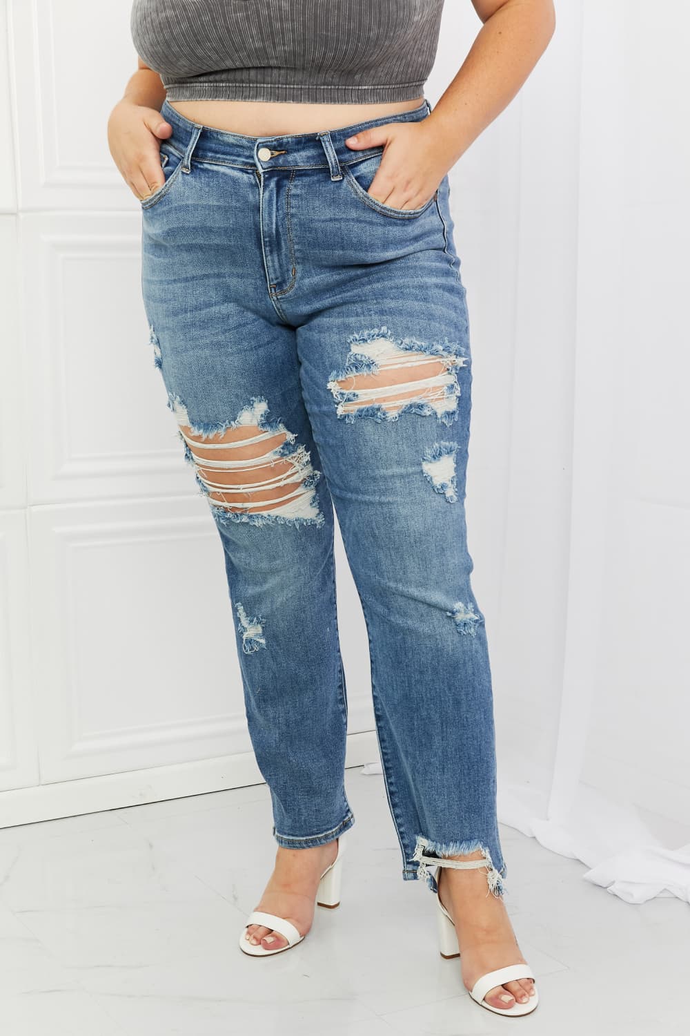These jeans are the perfect combination of style and comfort, making them a must-have in every fashion-forward individual's wardrobe.The heavy distressing adds a touch of edginess to the classic straight-leg silhouette, making them perfect for a night out with the girls or a casual weekend brunch.