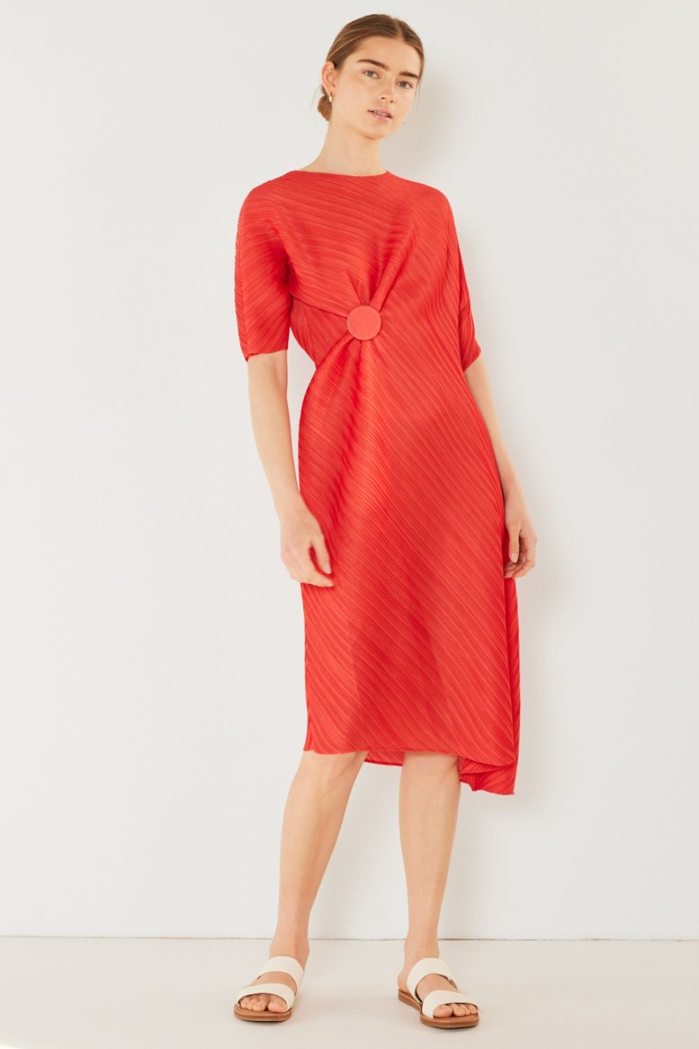 The Pleated Dolman Sleeve Dress is a modern and chic addition to your wardrobe. With its unique dolman sleeves and pleated detailing, this dress offers a stylish and sophisticated look. The relaxed silhouette and pleats create a flattering and comfortable fit.