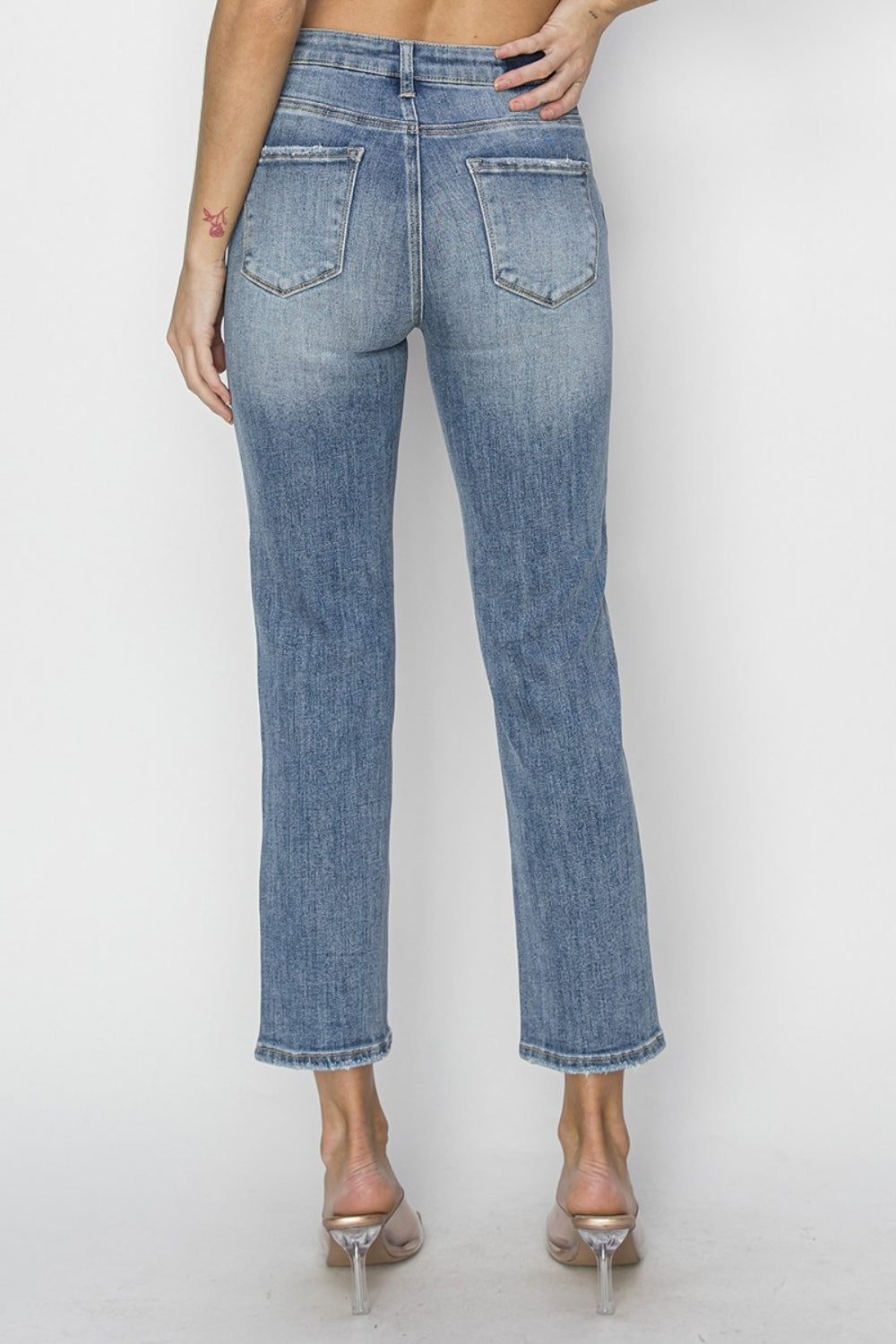 The High Waist Distressed Cropped Jeans are a trendy and edgy addition to your denim collection. The high waist design offers a flattering and on-trend silhouette. The distressed detailing adds a cool and rugged vibe to the cropped jeans.
