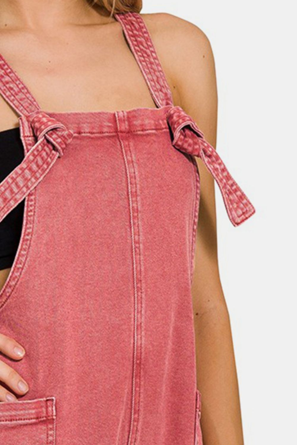 These Washed Knot Strap Rompers are the perfect blend of casual and chic style. The washed fabric gives them a relaxed and lived-in look, while the knot strap detail adds a touch of charm and uniqueness. S - L