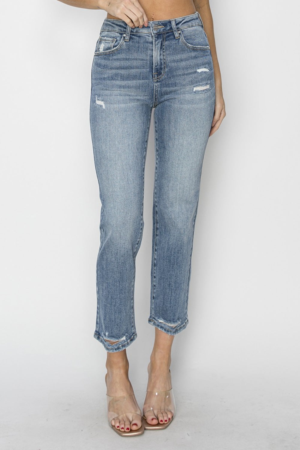 The High Waist Distressed Cropped Jeans are a trendy and edgy addition to your denim collection. The high waist design offers a flattering and on-trend silhouette. The distressed detailing adds a cool and rugged vibe to the cropped jeans.