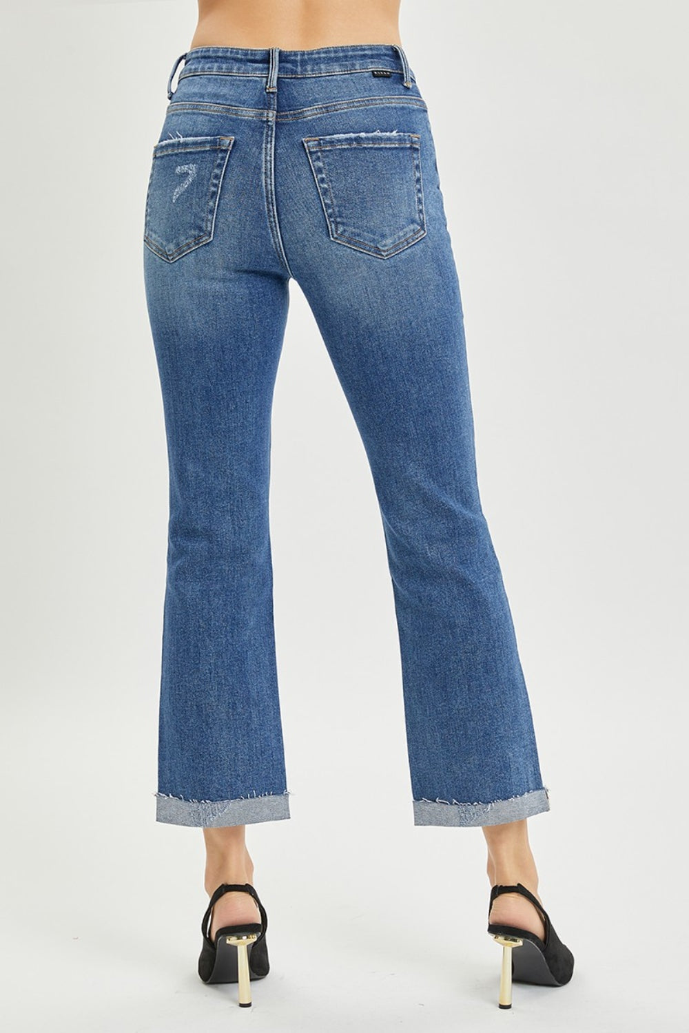 The Button-Fly Cropped Bootcut Jeans are a stylish and modern twist on a classic denim silhouette. The button fly closure adds a retro and chic touch to the cropped bootcut style. Made from high-quality denim fabric, these jeans are durable and comfortable for all-day wear. 0 - 3X