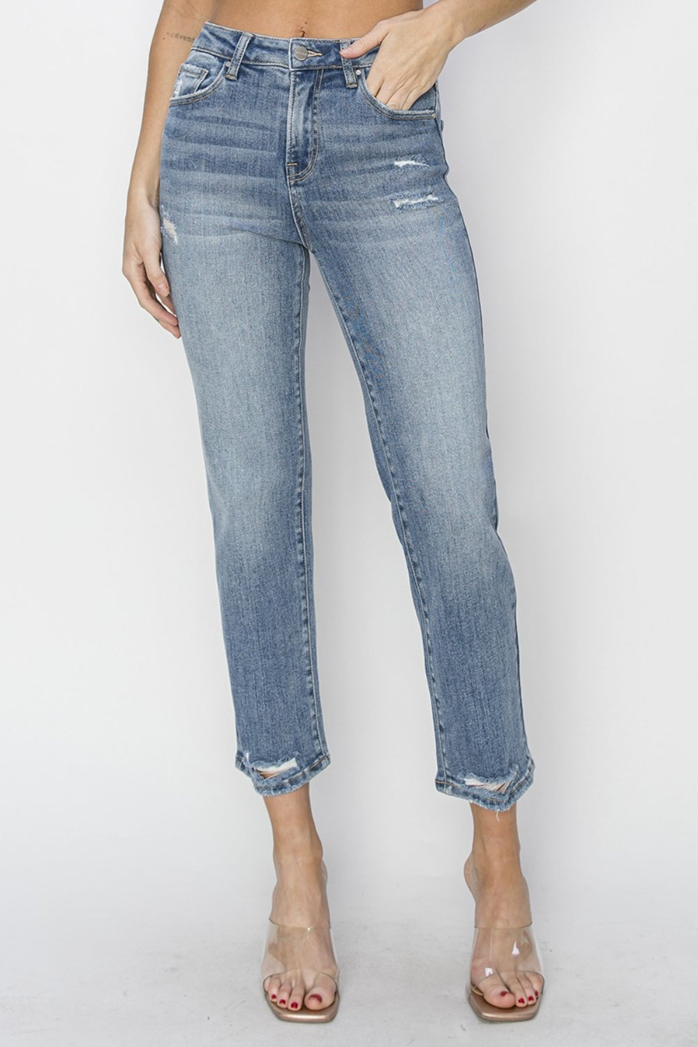 The High Waist Distressed Cropped Jeans are a trendy and edgy addition to your denim collection. The high waist design offers a flattering and on-trend silhouette. The distressed detailing adds a cool and rugged vibe to the cropped jeans.