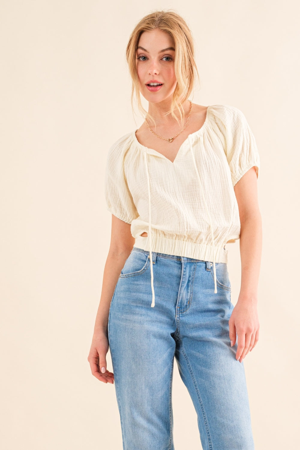 This Cotton Gauze Back Waist Tie Cropped Top is a stylish and versatile piece for your wardrobe. The back waist tie adds a unique touch to the design. Made with lightweight cotton gauze fabric, it is comfortable to wear in any season. S - XL