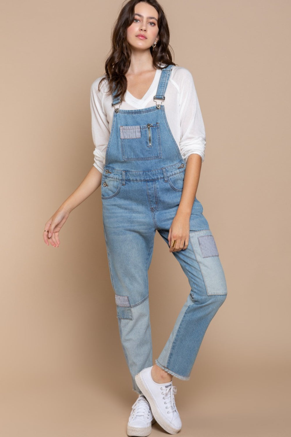 These Front Chest Zipper Slim Leg Denim Overalls are a stylish and modern addition to your wardrobe. The front chest zipper adds a unique and edgy touch to the classic overall design. With slim legs, these overalls provide a flattering silhouette and a sleek look. The denim fabric is durable and versatile, perfect for casual everyday wear. S - L