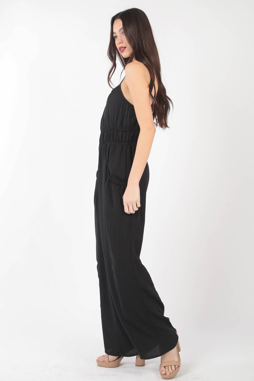 This Pintuck Detail Woven Sleeveless Jumpsuit is a chic and versatile piece for your wardrobe. The pintuck detailing adds a touch of sophistication to the sleeveless jumpsuit silhouette. Made from woven fabric, this jumpsuit offers a sleek and polished look. S - L