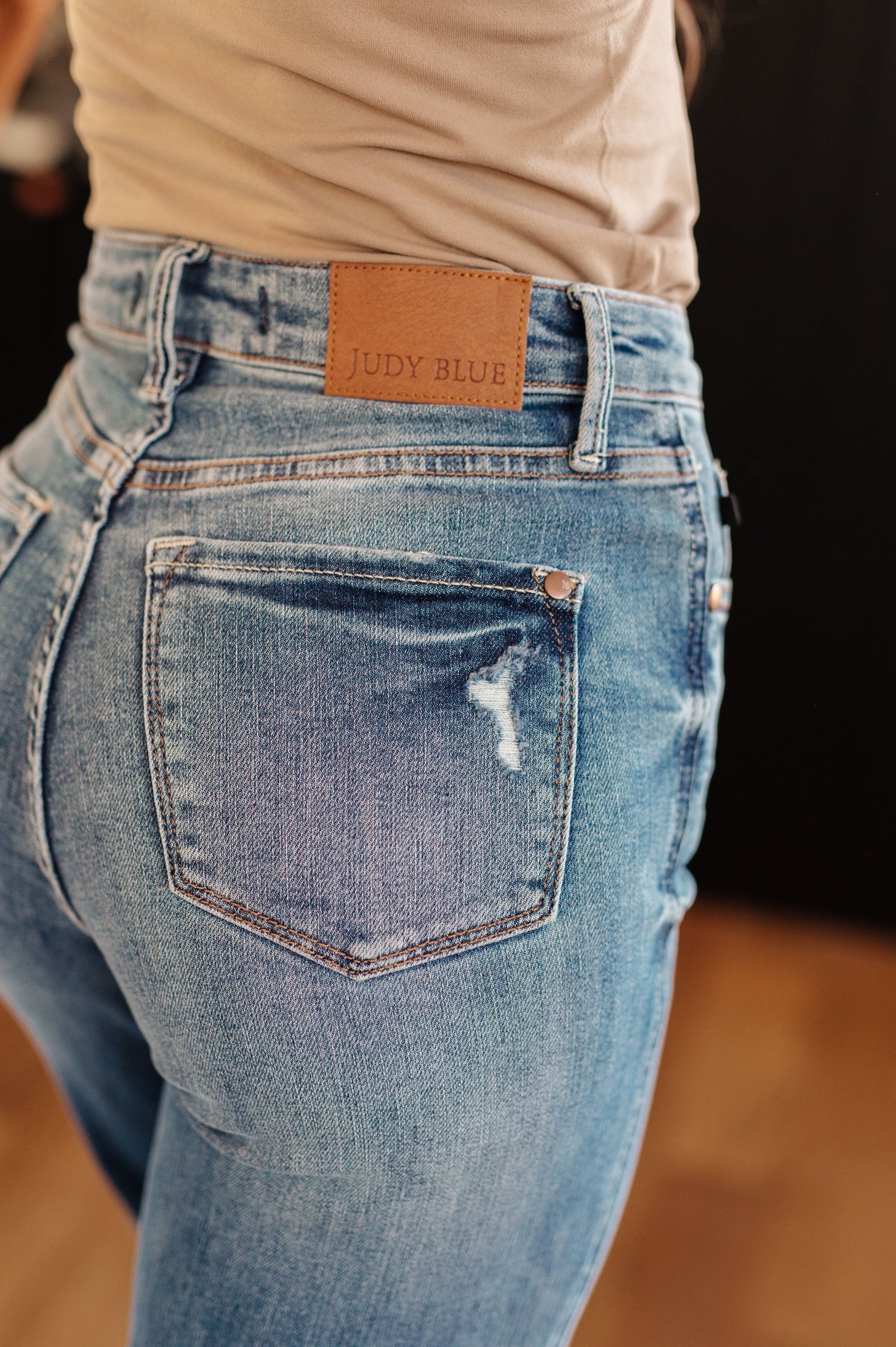Introducing the Bree High Rise Control Top Distressed Straight Jeans from Judy Blue - the perfect blend of fashion and function. With a flattering high rise and tummy control technology, these jeans will give you a confidence boost. The distressed details and medium wash add an edgy touch to the classic straight silhouette.  0 -24W