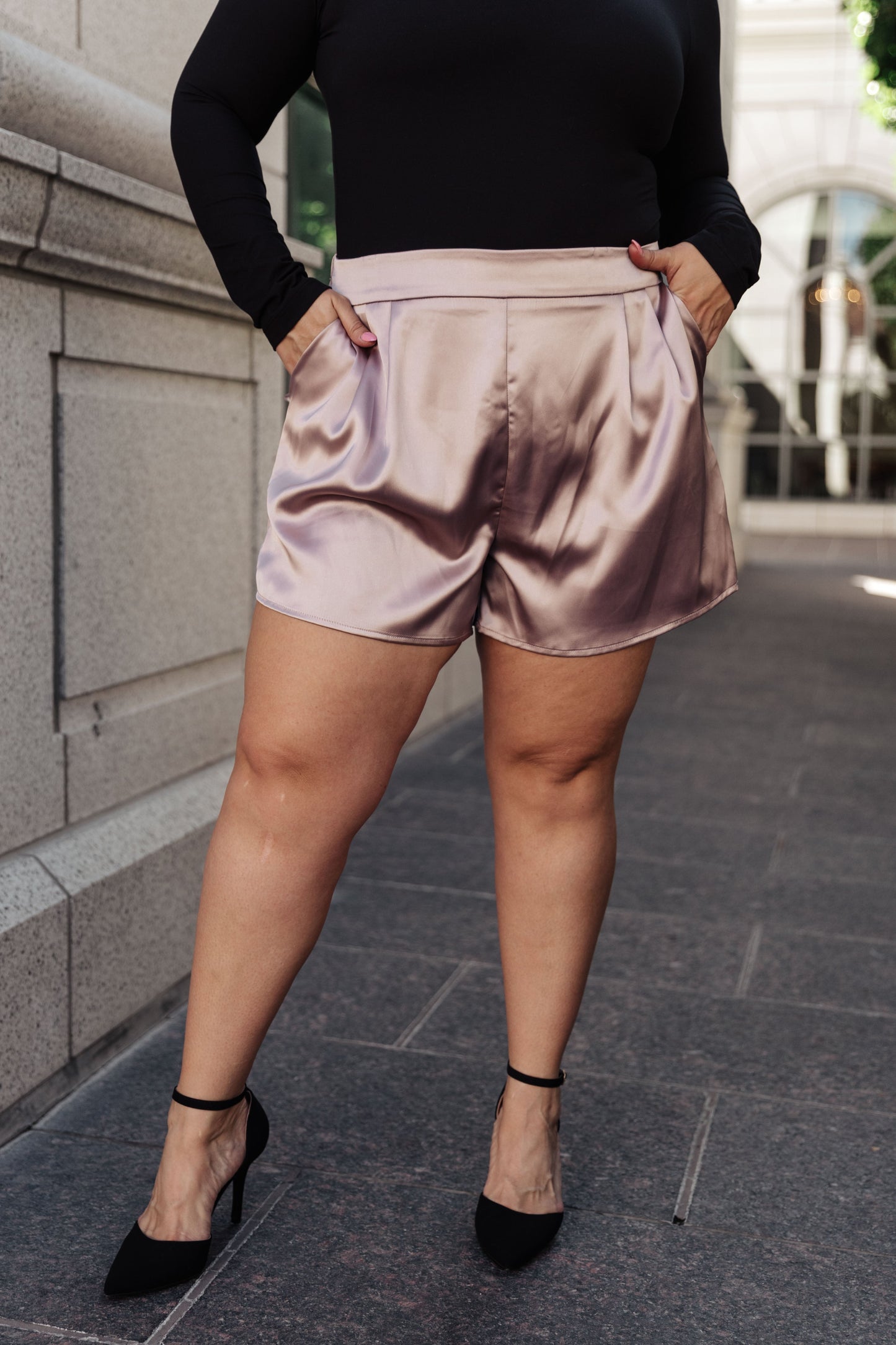 These chic Champagne and Roses Satin Shorts are perfect for making a statement. Crafted from a silky-smooth poly-satin, they feature a flattering flat-front design, pleated details, an elastic back waistband, and side pockets. Pair perfectly with the Champagne and Roses Satin Blazer for a complete look. S - 3X