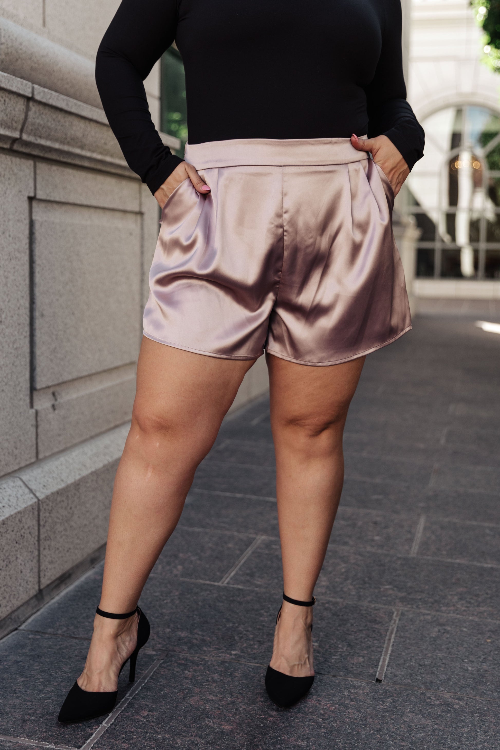 These chic Champagne and Roses Satin Shorts are perfect for making a statement. Crafted from a silky-smooth poly-satin, they feature a flattering flat-front design, pleated details, an elastic back waistband, and side pockets. Pair perfectly with the Champagne and Roses Satin Blazer for a complete look. S - 3X