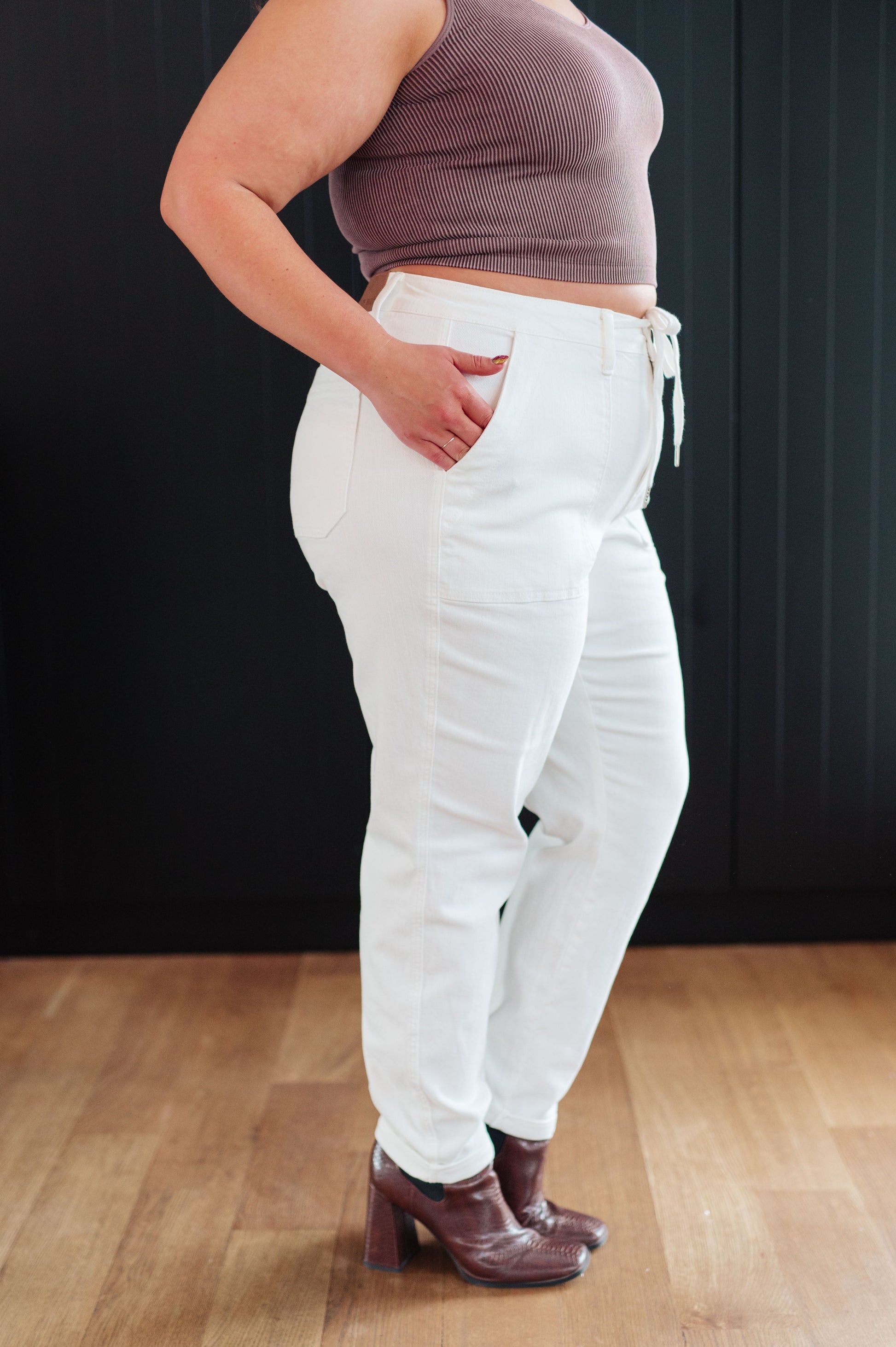 Take your laid-back look up a notch with the Charlene High Rise Jogger from Judy Blue. These versatile jeans highlights a high rise, perfect ecru color, and a drawstring waistband for a comfy fit while the jogger silhouette and optional cuffed hem adds a modern touch to your casual wardrobe. 0 - 24W