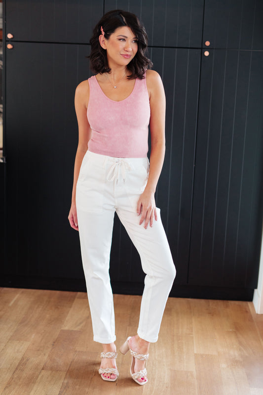 Take your laid-back look up a notch with the Charlene High Rise Jogger from Judy Blue. These versatile jeans highlights a high rise, perfect ecru color, and a drawstring waistband for a comfy fit while the jogger silhouette and optional cuffed hem adds a modern touch to your casual wardrobe. 0 - 24W