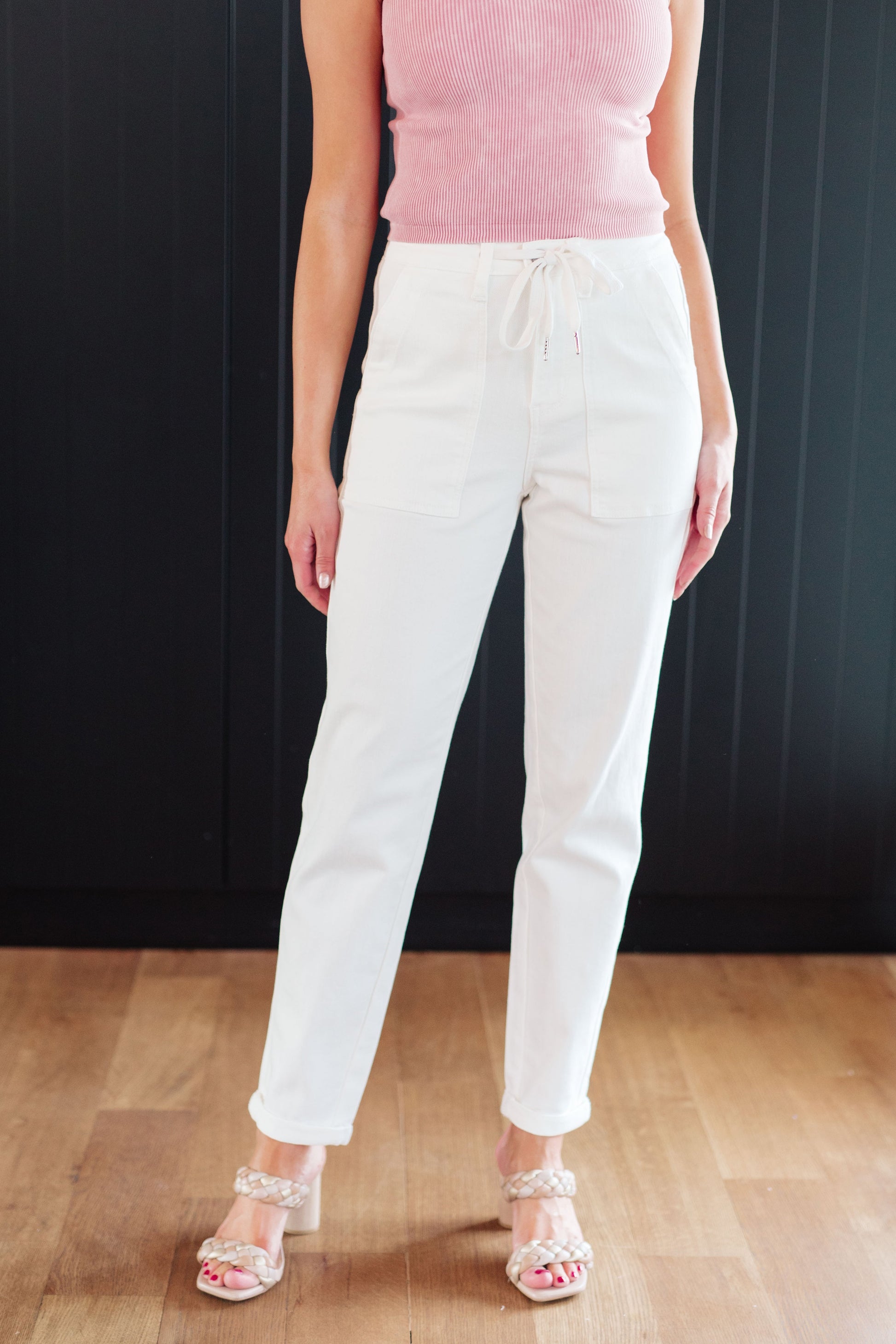 Take your laid-back look up a notch with the Charlene High Rise Jogger from Judy Blue. These versatile jeans highlights a high rise, perfect ecru color, and a drawstring waistband for a comfy fit while the jogger silhouette and optional cuffed hem adds a modern touch to your casual wardrobe. 0 - 24W