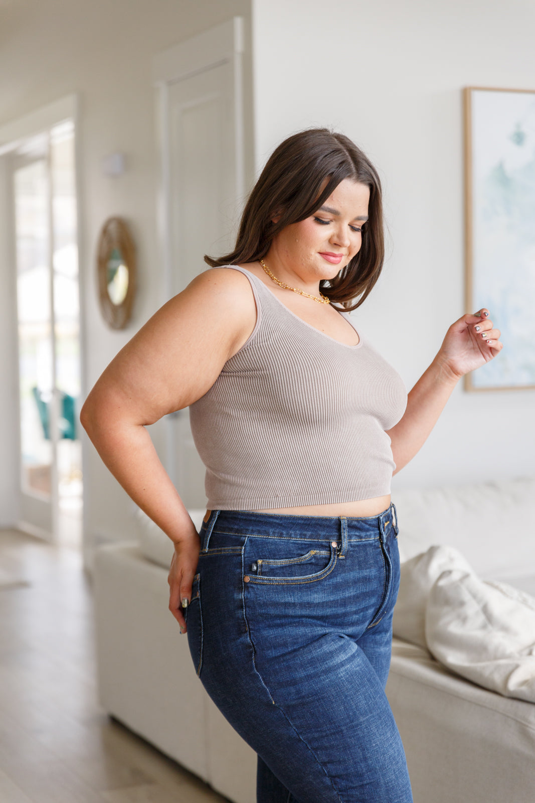 This tank is the perfect combination of function and fashion. Crafted from ribbed fabric with a seamless finish, it offers a flattering, cropped fit that can be customized with your choice of v-neck or scoop neck. Plus, its mineral wash makes it a true stand-out piece. S - 3X