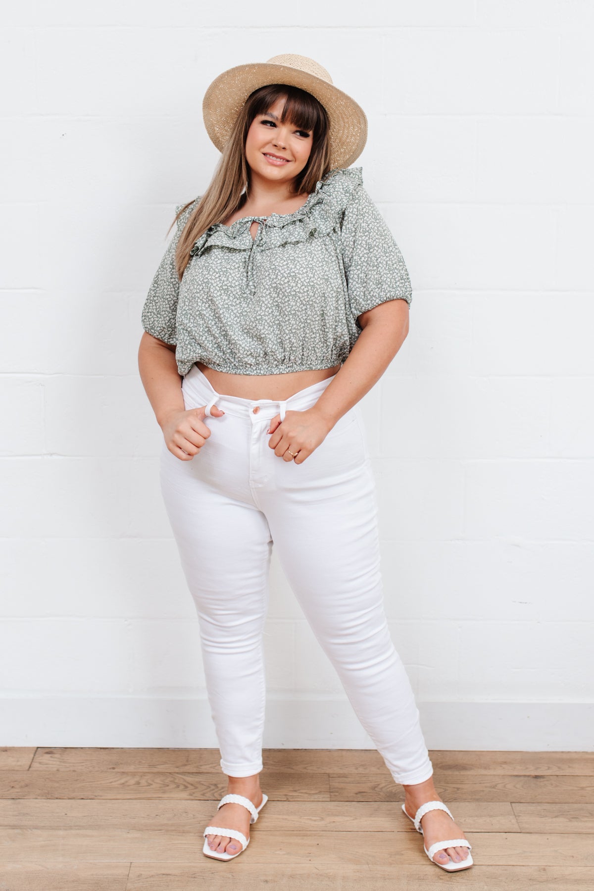 Head to date night in style in the Golden Hour Top! This cute top has all the details that we absolutely love. Featuring a ruffled elasticated neckline, keyhole detail on the front, balloon sleeves with elastic cuffs, and elastic waist. Not to mention it's in the most adorable tiny floral print! Pair with denim, nude sandals, and matching bag for an on trend look! S - 3X