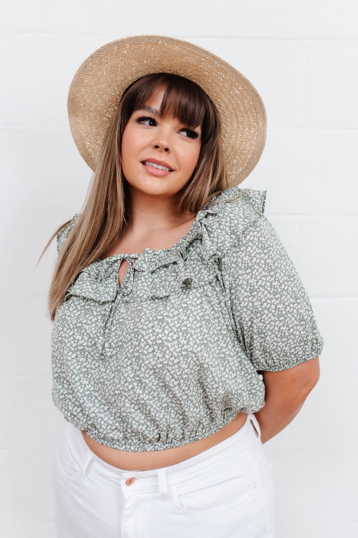 Head to date night in style in the Golden Hour Top! This cute top has all the details that we absolutely love. Featuring a ruffled elasticated neckline, keyhole detail on the front, balloon sleeves with elastic cuffs, and elastic waist. Not to mention it's in the most adorable tiny floral print! Pair with denim, nude sandals, and matching bag for an on trend look! S - 3X