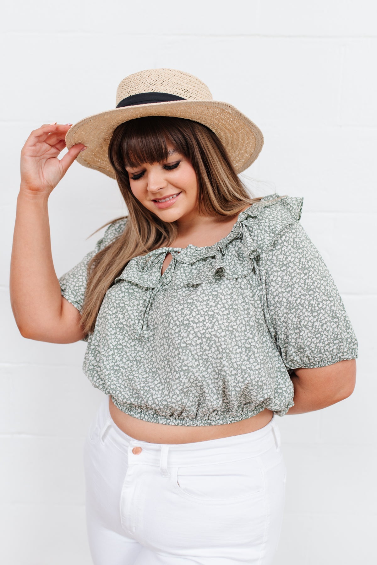 Head to date night in style in the Golden Hour Top! This cute top has all the details that we absolutely love. Featuring a ruffled elasticated neckline, keyhole detail on the front, balloon sleeves with elastic cuffs, and elastic waist. Not to mention it's in the most adorable tiny floral print! Pair with denim, nude sandals, and matching bag for an on trend look! S - 3X