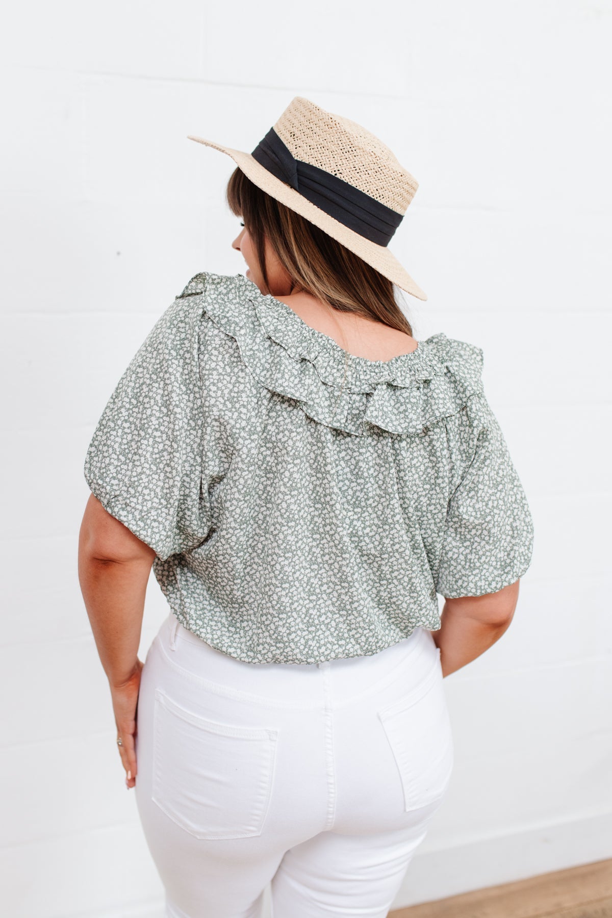 Head to date night in style in the Golden Hour Top! This cute top has all the details that we absolutely love. Featuring a ruffled elasticated neckline, keyhole detail on the front, balloon sleeves with elastic cuffs, and elastic waist. Not to mention it's in the most adorable tiny floral print! Pair with denim, nude sandals, and matching bag for an on trend look! S - 3X