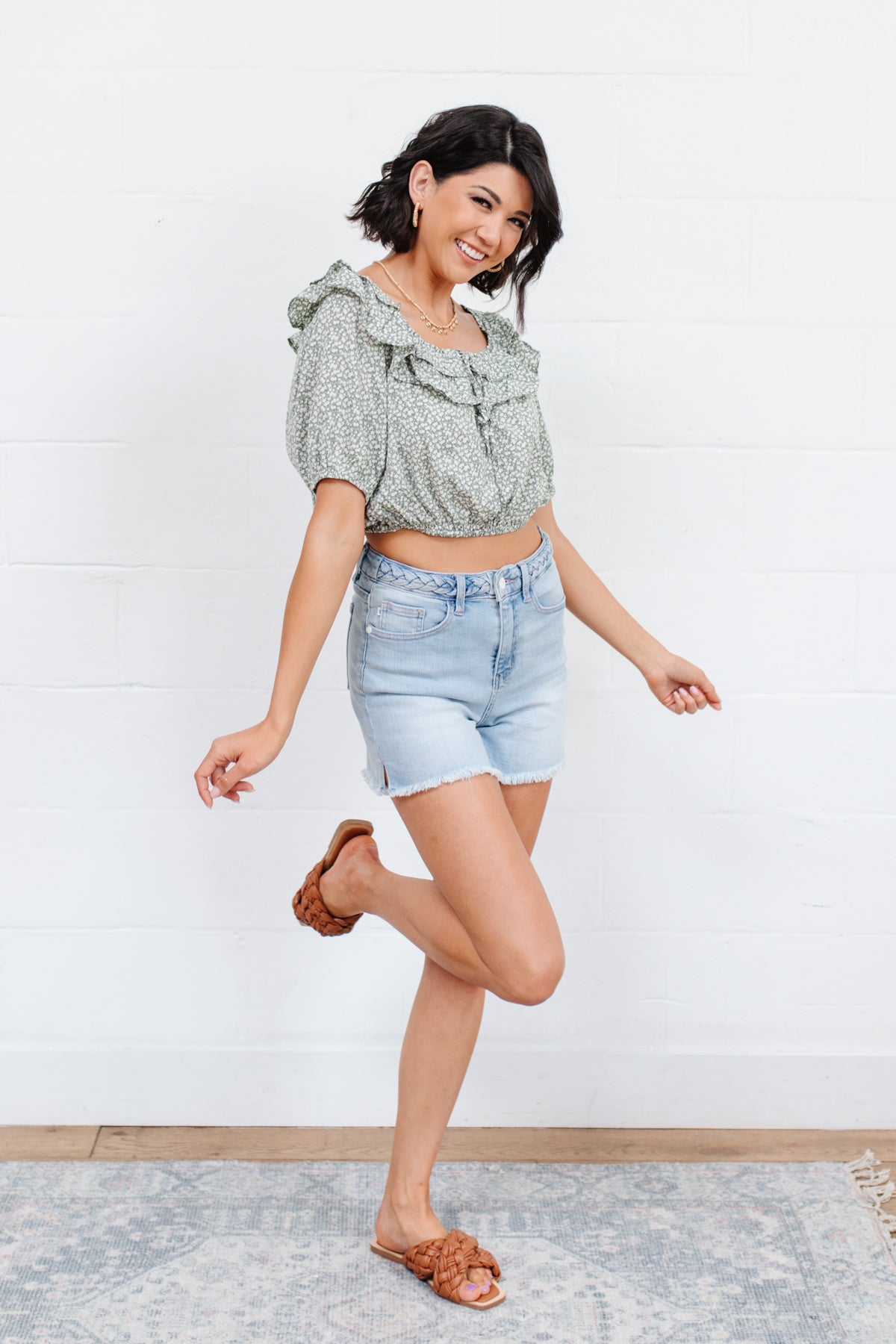 Head to date night in style in the Golden Hour Top! This cute top has all the details that we absolutely love. Featuring a ruffled elasticated neckline, keyhole detail on the front, balloon sleeves with elastic cuffs, and elastic waist. Not to mention it's in the most adorable tiny floral print! Pair with denim, nude sandals, and matching bag for an on trend look! S - 3X