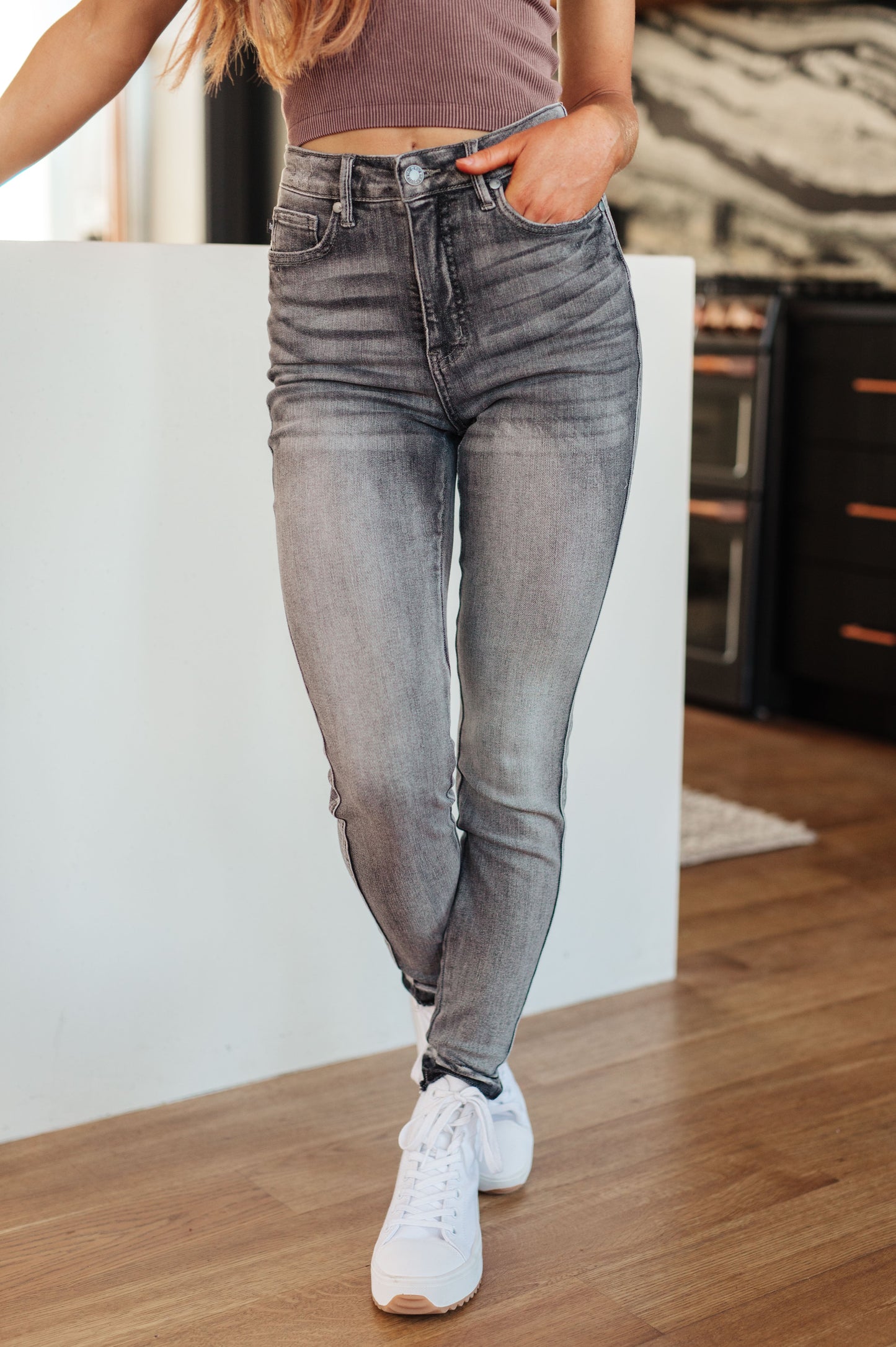 Get ready for a stylish and comfortable fit with our Hadley High Rise Control Top Release Hem Skinny Jeans from Judy Blue! Our tummy control technology will give you a flattering silhouette, while the released hem adds a trendy touch to the washed out gray color. Elevate your wardrobe today! 0 - 24W
