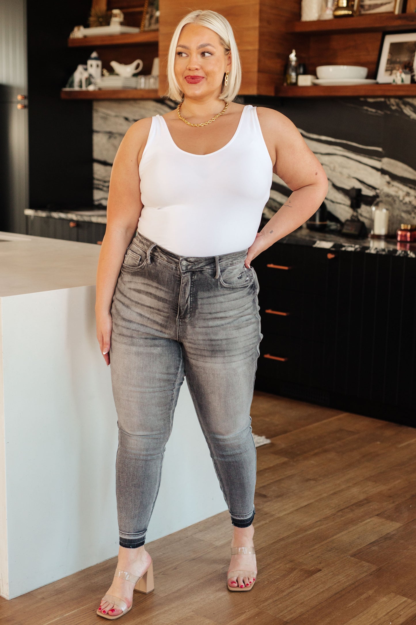 Get ready for a stylish and comfortable fit with our Hadley High Rise Control Top Release Hem Skinny Jeans from Judy Blue! Our tummy control technology will give you a flattering silhouette, while the released hem adds a trendy touch to the washed out gray color. Elevate your wardrobe today! 0 - 24W