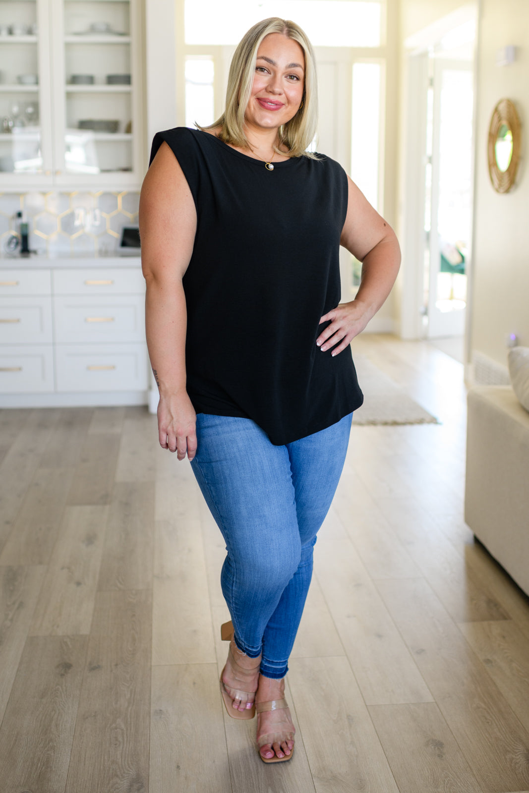 This Juke Box Hero Shoulder Pad Top is perfect for your next night out. Crafted with comfy jersey knit material, it features sewn in shoulder pads for a flattering fit and side slits for a modern, edgy look. Its stretchy material allows for versatile styling. Get ready to turn heads! S - 3X