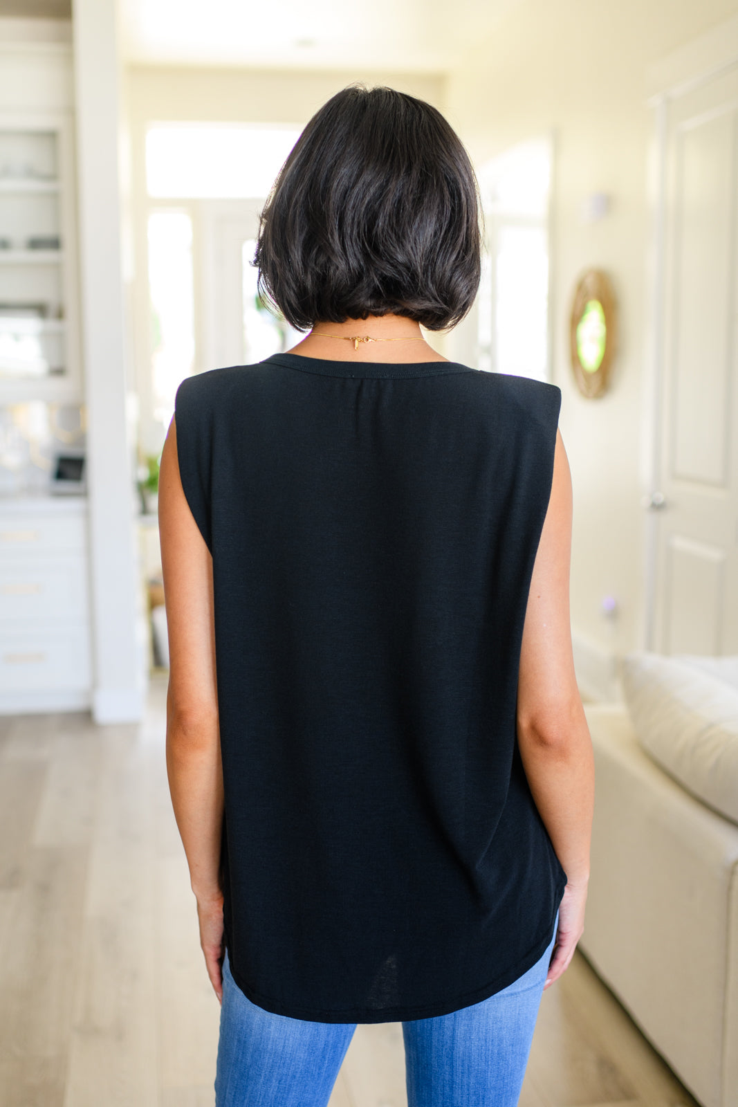 This Juke Box Hero Shoulder Pad Top is perfect for your next night out. Crafted with comfy jersey knit material, it features sewn in shoulder pads for a flattering fit and side slits for a modern, edgy look. Its stretchy material allows for versatile styling. Get ready to turn heads! S - 3X