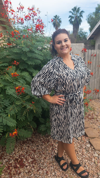 Get in touch with your bold and wild side! This dress is classy, sassy, and badassy! Colors are black and off white. This zebra print dress features a ruffle collar, ¾ balloon sleeves with ruffles, waist tie, v-neck, and sits below the knees. Good for a night out with the girls, office or business attire. Don’t be afraid to get creative! Sizes small through large.
